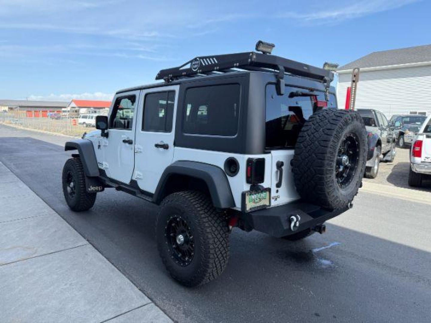 2016 Bright White Clearcoat /Black Jeep Wrangler Unlimited Rubicon (1C4BJWFG1GL) with an Pentastar 3.6L V-6 DOHC engine, AUTOMATIC transmission, located at 1235 N Woodruff Ave., Idaho Falls, 83401, (208) 523-1053, 43.507172, -112.000488 - Photo#1