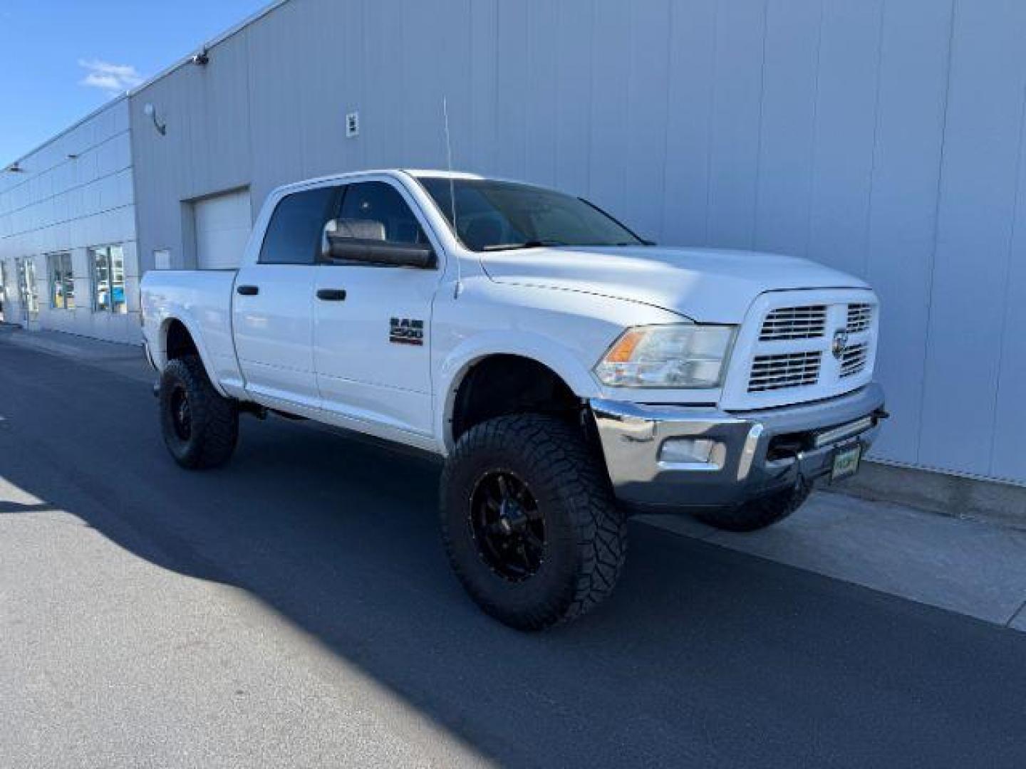 2012 Bright White Clearcoat /Medium Greystone/Dark Slate Ram 2500 SLT (3C6UD5DL6CG) with an Cummins 6.7L I-6 diesel direct injection engine, AUTOMATIC transmission, located at 1235 N Woodruff Ave., Idaho Falls, 83401, (208) 523-1053, 43.507172, -112.000488 - Photo#5