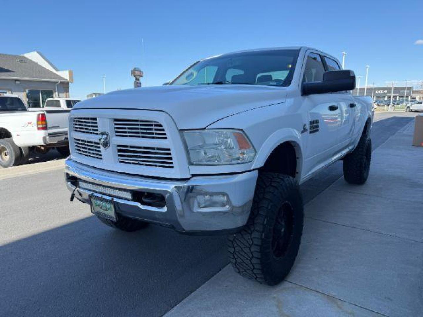 2012 Bright White Clearcoat /Medium Greystone/Dark Slate Ram 2500 SLT (3C6UD5DL6CG) with an Cummins 6.7L I-6 diesel direct injection engine, AUTOMATIC transmission, located at 1235 N Woodruff Ave., Idaho Falls, 83401, (208) 523-1053, 43.507172, -112.000488 - Photo#0
