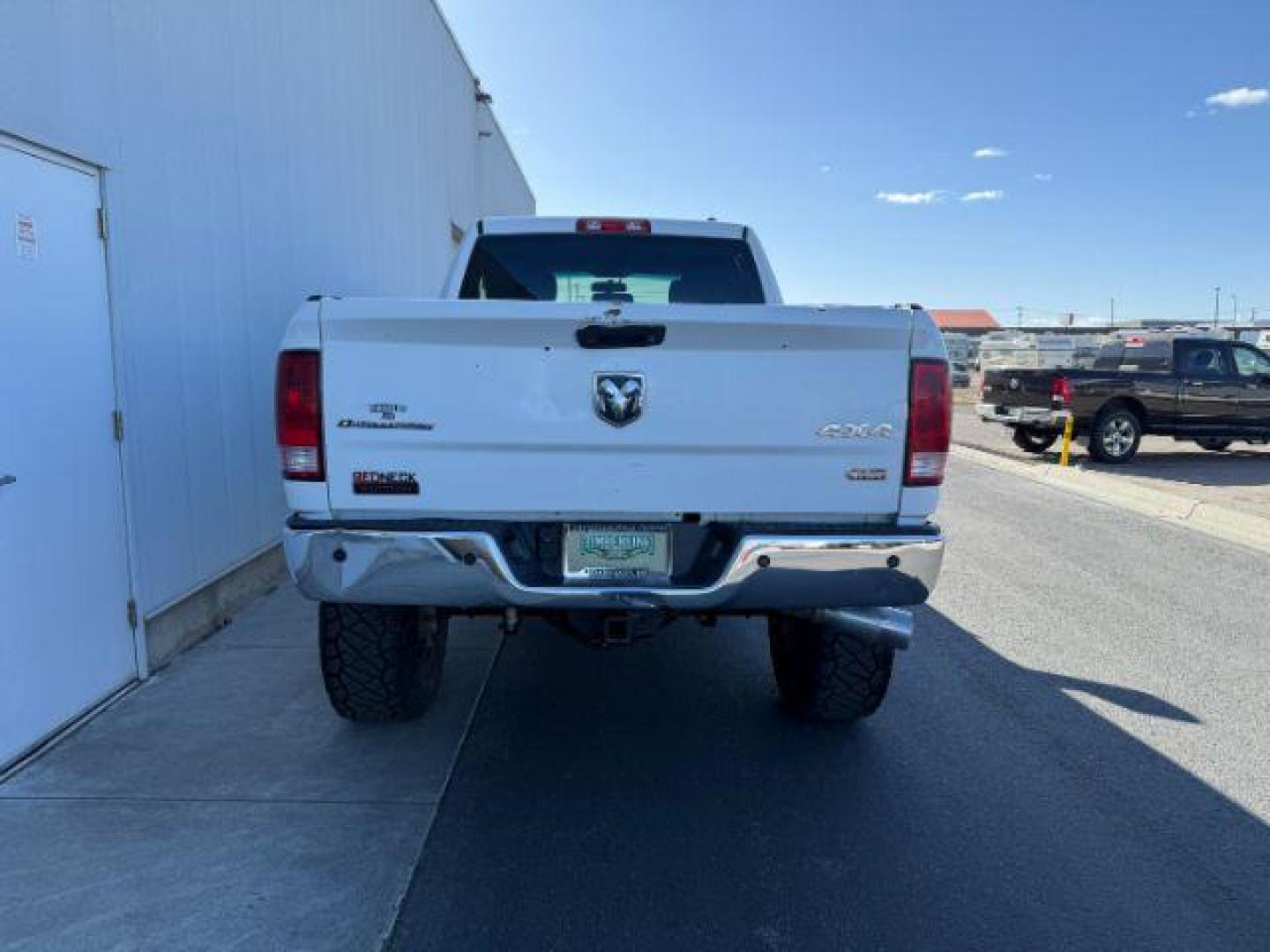 2012 Bright White Clearcoat /Medium Greystone/Dark Slate Ram 2500 SLT (3C6UD5DL6CG) with an Cummins 6.7L I-6 diesel direct injection engine, AUTOMATIC transmission, located at 1235 N Woodruff Ave., Idaho Falls, 83401, (208) 523-1053, 43.507172, -112.000488 - Photo#2