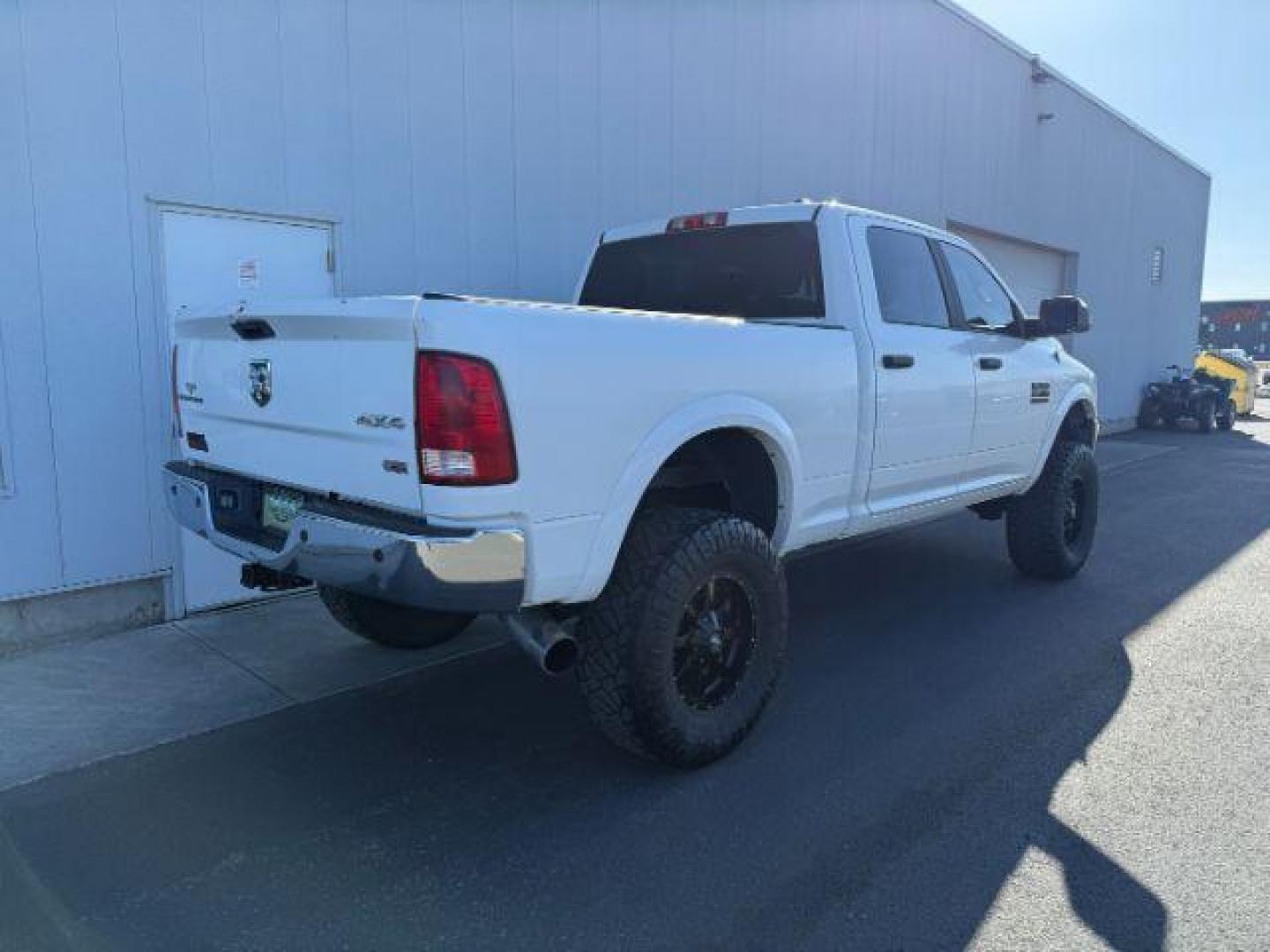 2012 Bright White Clearcoat /Medium Greystone/Dark Slate Ram 2500 SLT (3C6UD5DL6CG) with an Cummins 6.7L I-6 diesel direct injection engine, AUTOMATIC transmission, located at 1235 N Woodruff Ave., Idaho Falls, 83401, (208) 523-1053, 43.507172, -112.000488 - Photo#3