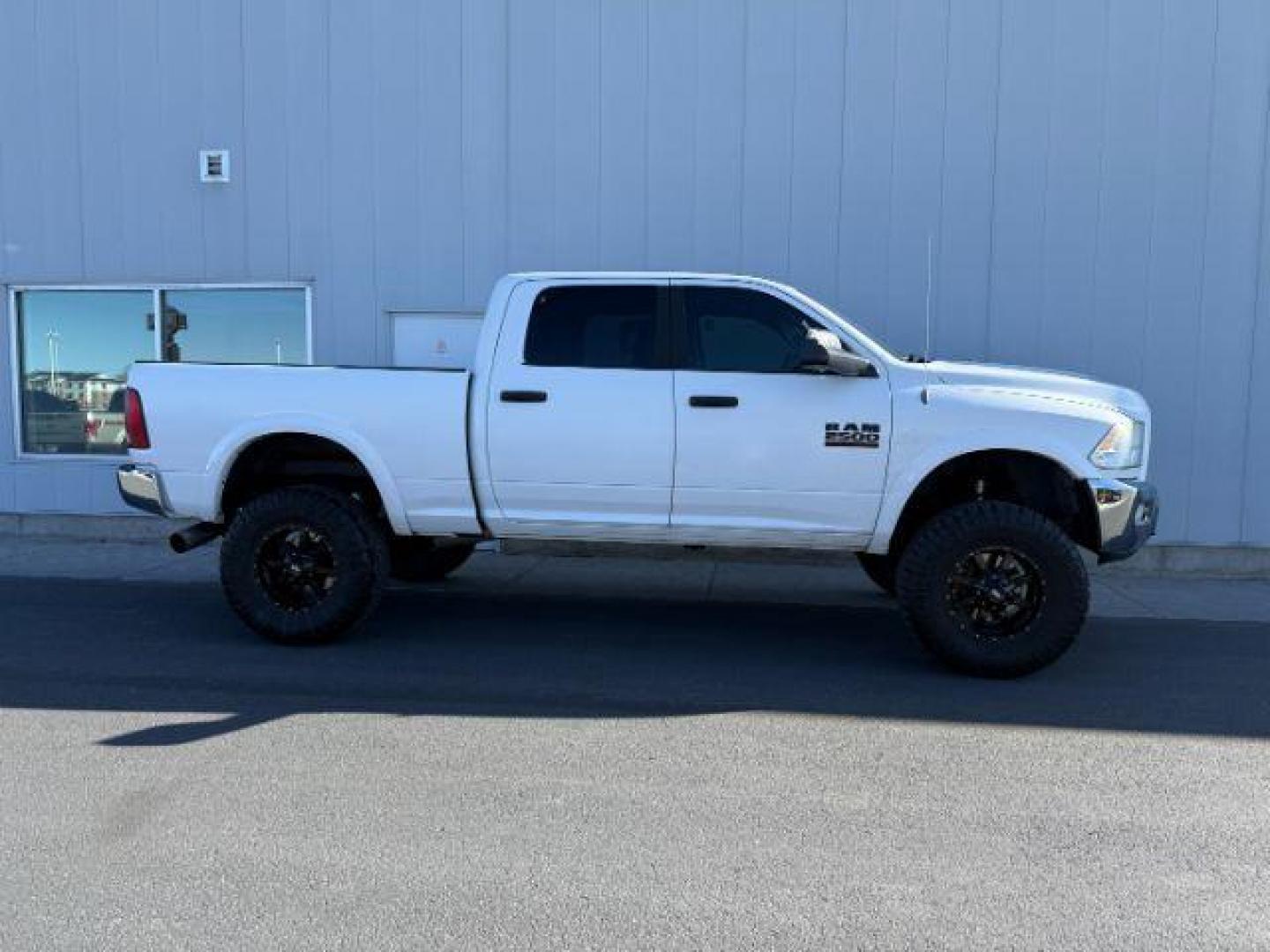 2012 Bright White Clearcoat /Medium Greystone/Dark Slate Ram 2500 SLT (3C6UD5DL6CG) with an Cummins 6.7L I-6 diesel direct injection engine, AUTOMATIC transmission, located at 1235 N Woodruff Ave., Idaho Falls, 83401, (208) 523-1053, 43.507172, -112.000488 - Photo#4