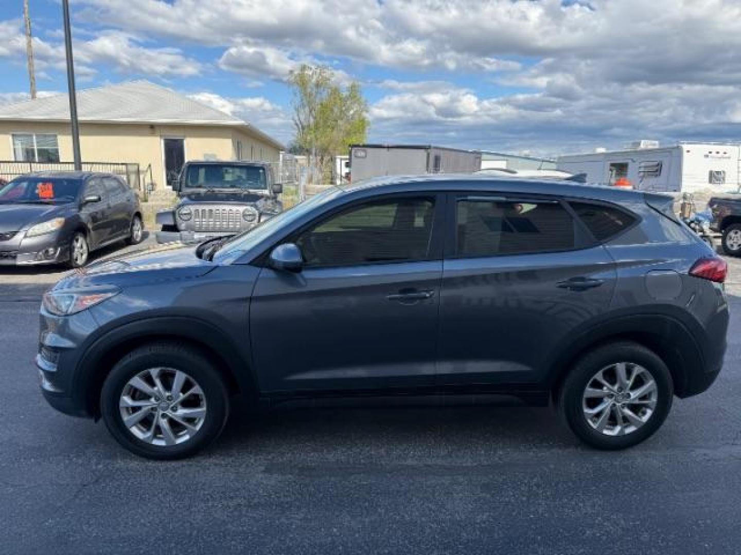 2019 GRAY /Black Hyundai Tucson SE (KM8J2CA43KU) with an Nu 2L I-4 gasoline direct injection engine, AUTOMATIC transmission, located at 1235 N Woodruff Ave., Idaho Falls, 83401, (208) 523-1053, 43.507172, -112.000488 - At Timberline Auto, finding a great deal on your next vehicle is always easy! Our experienced sales staff's goal is to help find you the right vehicle at the right price! Our knowledgeable finance department has options for almost any credit score. We offer extended service contract options to prote - Photo#1