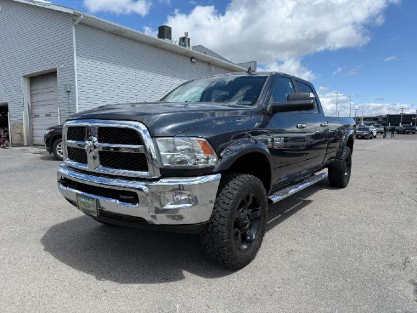 2014 Black Clearcoat /Diesel Gray/Black Ram 3500 SLT (3C63R3HL7EG) with an Cummins 6.7L I-6 diesel direct injection engine, AUTOMATIC transmission, located at 1235 N Woodruff Ave., Idaho Falls, 83401, (208) 523-1053, 43.507172, -112.000488 - At Timberline Auto, finding a great deal on your next vehicle is always easy! Our experienced sales staff's goal is to help find you the right vehicle at the right price! Our knowledgeable finance department has options for almost any credit score. We offer extended service contract options to prote - Photo#0