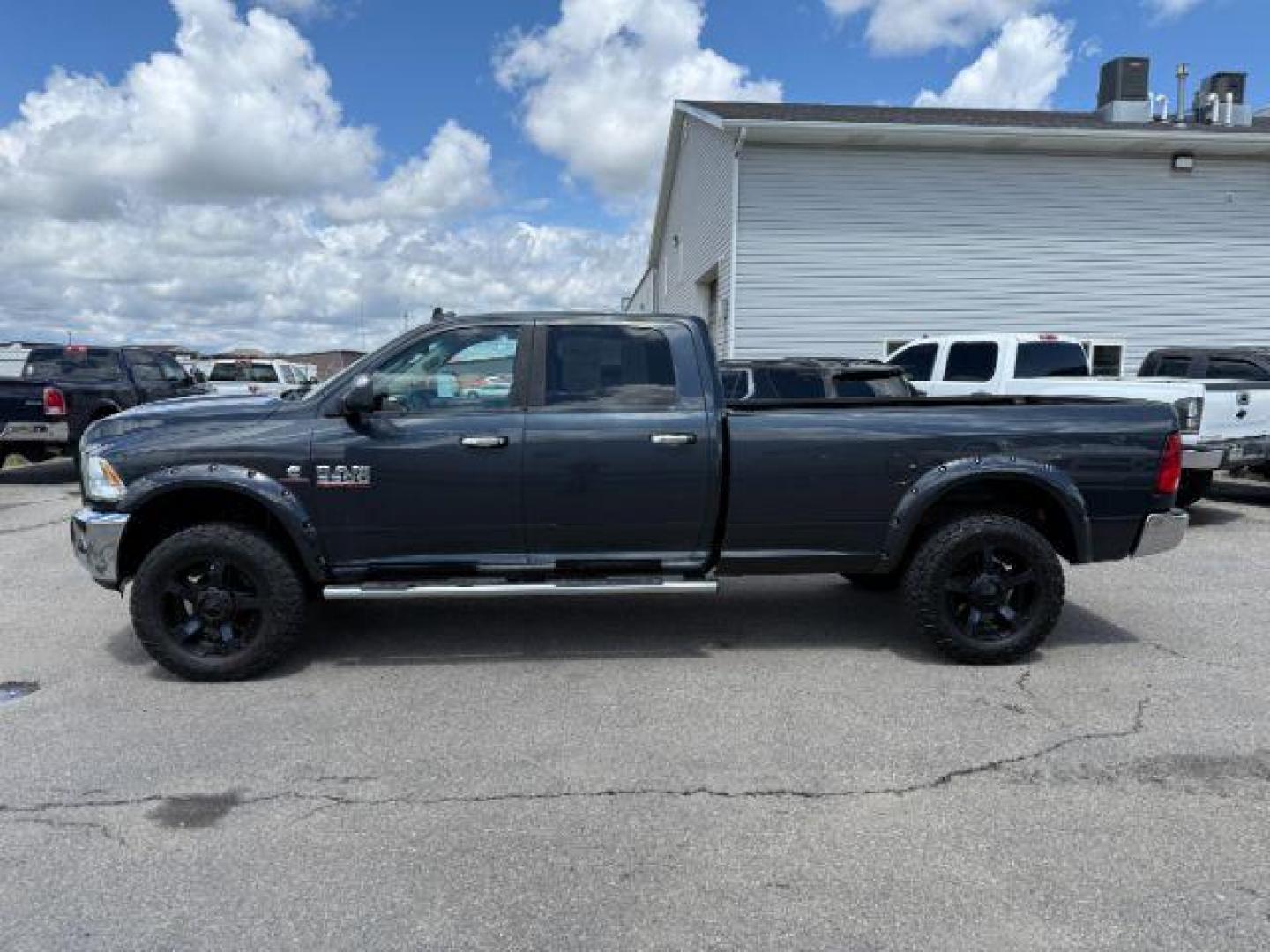 2014 Black Clearcoat /Diesel Gray/Black Ram 3500 SLT (3C63R3HL7EG) with an Cummins 6.7L I-6 diesel direct injection engine, AUTOMATIC transmission, located at 1235 N Woodruff Ave., Idaho Falls, 83401, (208) 523-1053, 43.507172, -112.000488 - At Timberline Auto, finding a great deal on your next vehicle is always easy! Our experienced sales staff's goal is to help find you the right vehicle at the right price! Our knowledgeable finance department has options for almost any credit score. We offer extended service contract options to prote - Photo#1
