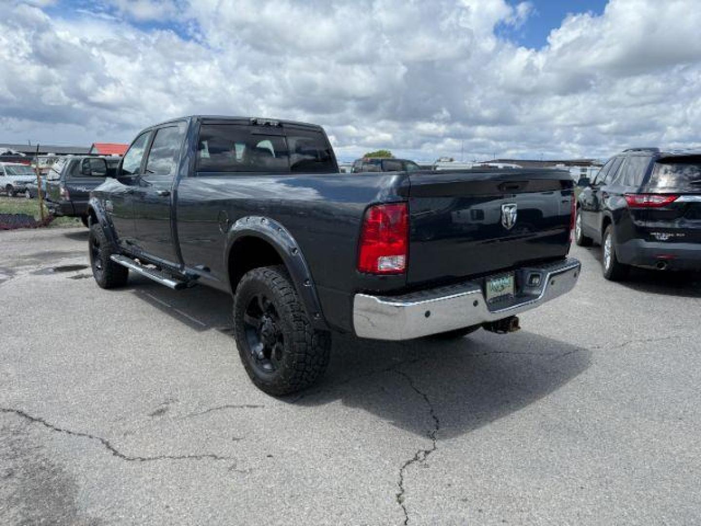 2014 Black Clearcoat /Diesel Gray/Black Ram 3500 SLT (3C63R3HL7EG) with an Cummins 6.7L I-6 diesel direct injection engine, AUTOMATIC transmission, located at 1235 N Woodruff Ave., Idaho Falls, 83401, (208) 523-1053, 43.507172, -112.000488 - At Timberline Auto, finding a great deal on your next vehicle is always easy! Our experienced sales staff's goal is to help find you the right vehicle at the right price! Our knowledgeable finance department has options for almost any credit score. We offer extended service contract options to prote - Photo#2