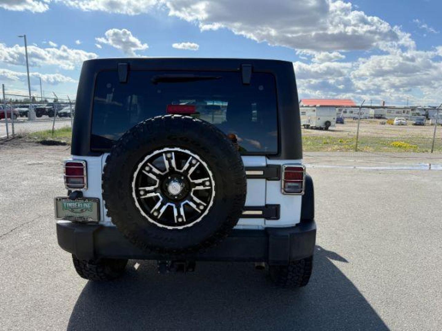 2012 Bright White Clearcoat /Black Jeep Wrangler Unlimited Rubicon (1C4BJWFG8CL) with an 3.6L V-6 DOHC engine, AUTOMATIC transmission, located at 1235 N Woodruff Ave., Idaho Falls, 83401, (208) 523-1053, 43.507172, -112.000488 - At Timberline Auto, finding a great deal on your next vehicle is always easy! Our experienced sales staff's goal is to help find you the right vehicle at the right price! Our knowledgeable finance department has options for almost any credit score. We offer extended service contract options to prote - Photo#3