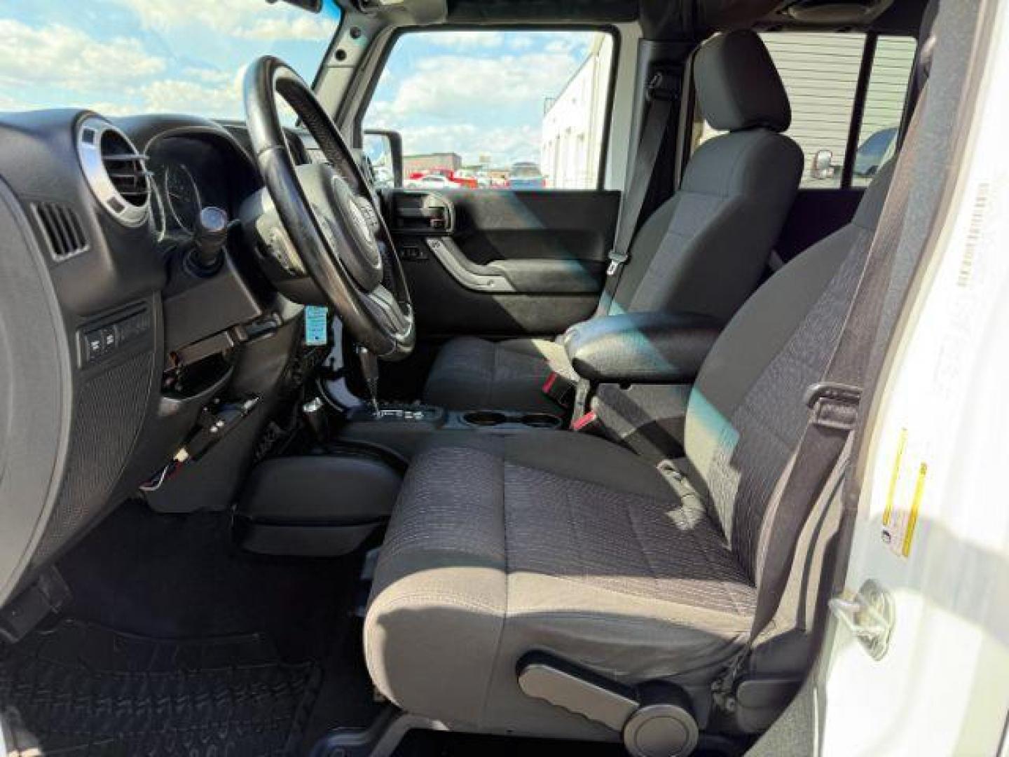 2012 Bright White Clearcoat /Black Jeep Wrangler Unlimited Rubicon (1C4BJWFG8CL) with an 3.6L V-6 DOHC engine, AUTOMATIC transmission, located at 1235 N Woodruff Ave., Idaho Falls, 83401, (208) 523-1053, 43.507172, -112.000488 - At Timberline Auto, finding a great deal on your next vehicle is always easy! Our experienced sales staff's goal is to help find you the right vehicle at the right price! Our knowledgeable finance department has options for almost any credit score. We offer extended service contract options to prote - Photo#10