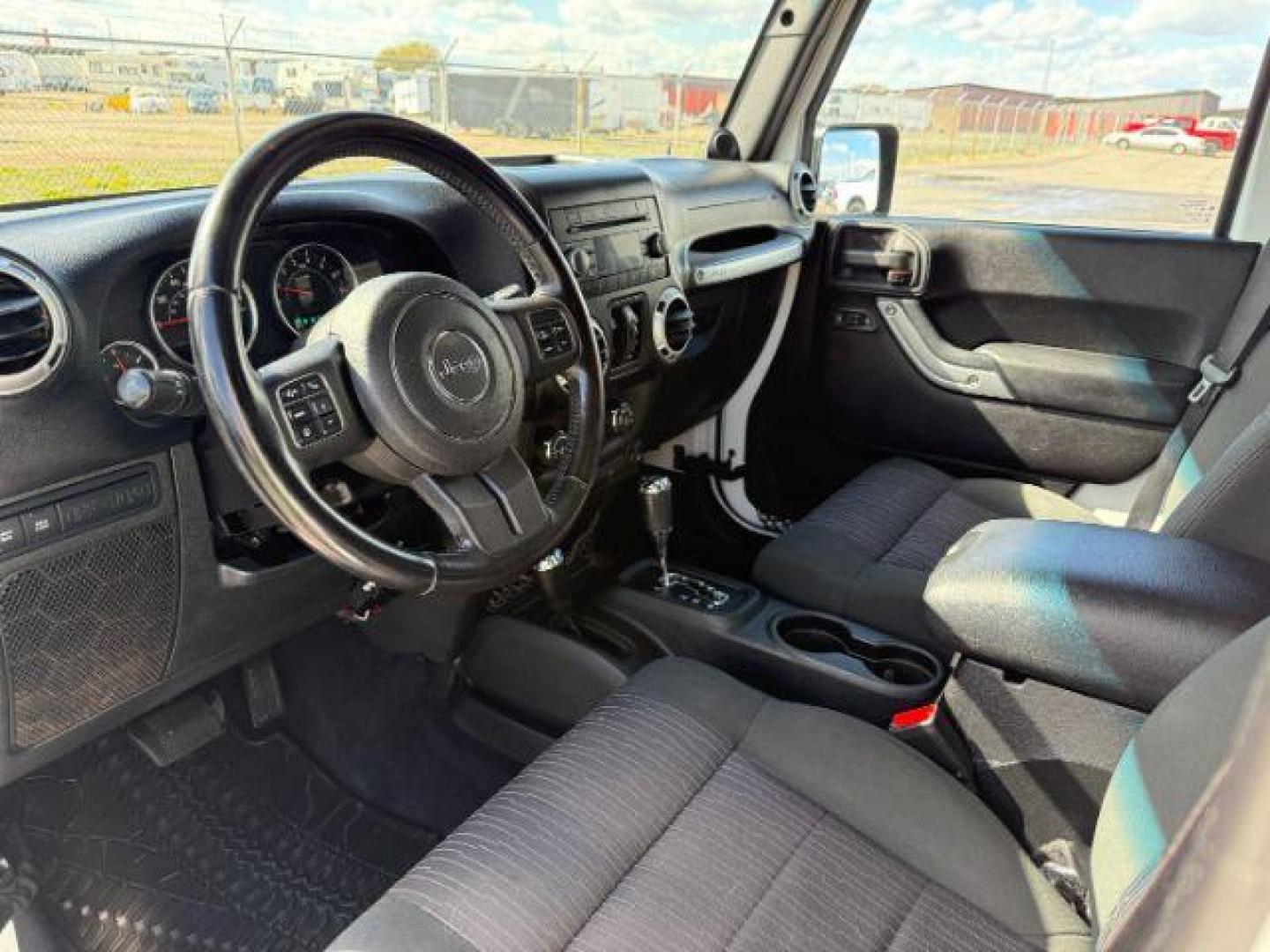 2012 Bright White Clearcoat /Black Jeep Wrangler Unlimited Rubicon (1C4BJWFG8CL) with an 3.6L V-6 DOHC engine, AUTOMATIC transmission, located at 1235 N Woodruff Ave., Idaho Falls, 83401, (208) 523-1053, 43.507172, -112.000488 - At Timberline Auto, finding a great deal on your next vehicle is always easy! Our experienced sales staff's goal is to help find you the right vehicle at the right price! Our knowledgeable finance department has options for almost any credit score. We offer extended service contract options to prote - Photo#11
