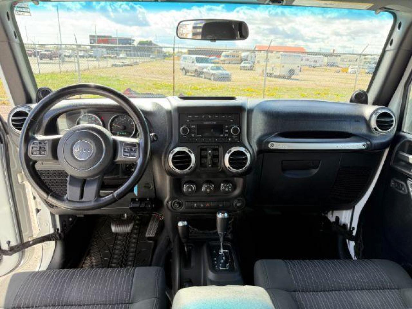 2012 Bright White Clearcoat /Black Jeep Wrangler Unlimited Rubicon (1C4BJWFG8CL) with an 3.6L V-6 DOHC engine, AUTOMATIC transmission, located at 1235 N Woodruff Ave., Idaho Falls, 83401, (208) 523-1053, 43.507172, -112.000488 - At Timberline Auto, finding a great deal on your next vehicle is always easy! Our experienced sales staff's goal is to help find you the right vehicle at the right price! Our knowledgeable finance department has options for almost any credit score. We offer extended service contract options to prote - Photo#17