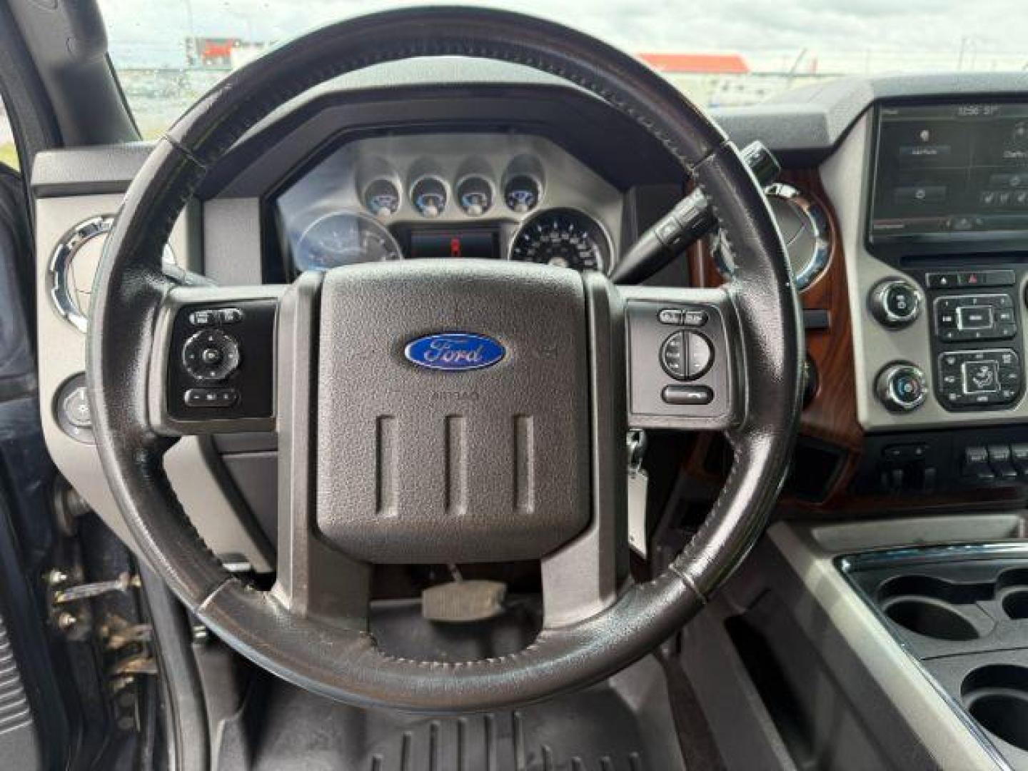 2014 Tuxedo Black Metallic /Black Ford F-350 LARIAT (1FT8W3BT7EE) with an Powerstroke 6.7L V-8 diesel direct injection engine, AUTOMATIC transmission, located at 1235 N Woodruff Ave., Idaho Falls, 83401, (208) 523-1053, 43.507172, -112.000488 - At Timberline Auto, finding a great deal on your next vehicle is always easy! Our experienced sales staff's goal is to help find you the right vehicle at the right price! Our knowledgeable finance department has options for almost any credit score. We offer extended service contract options to prote - Photo#12