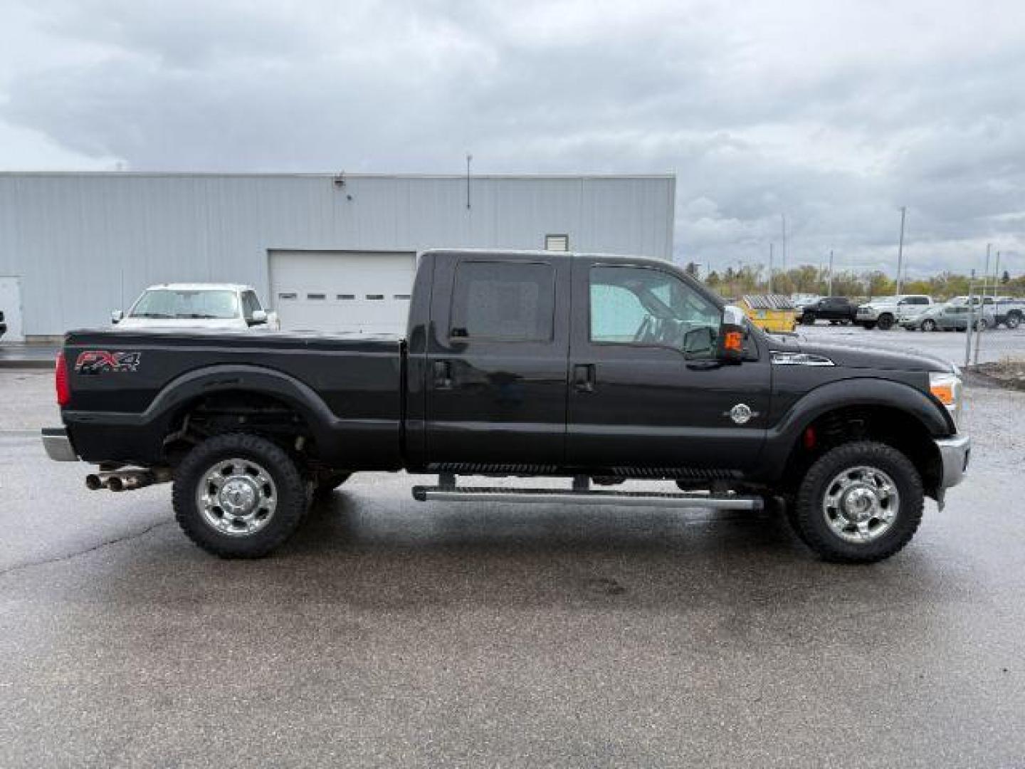2014 Tuxedo Black Metallic /Black Ford F-350 LARIAT (1FT8W3BT7EE) with an Powerstroke 6.7L V-8 diesel direct injection engine, AUTOMATIC transmission, located at 1235 N Woodruff Ave., Idaho Falls, 83401, (208) 523-1053, 43.507172, -112.000488 - At Timberline Auto, finding a great deal on your next vehicle is always easy! Our experienced sales staff's goal is to help find you the right vehicle at the right price! Our knowledgeable finance department has options for almost any credit score. We offer extended service contract options to prote - Photo#6