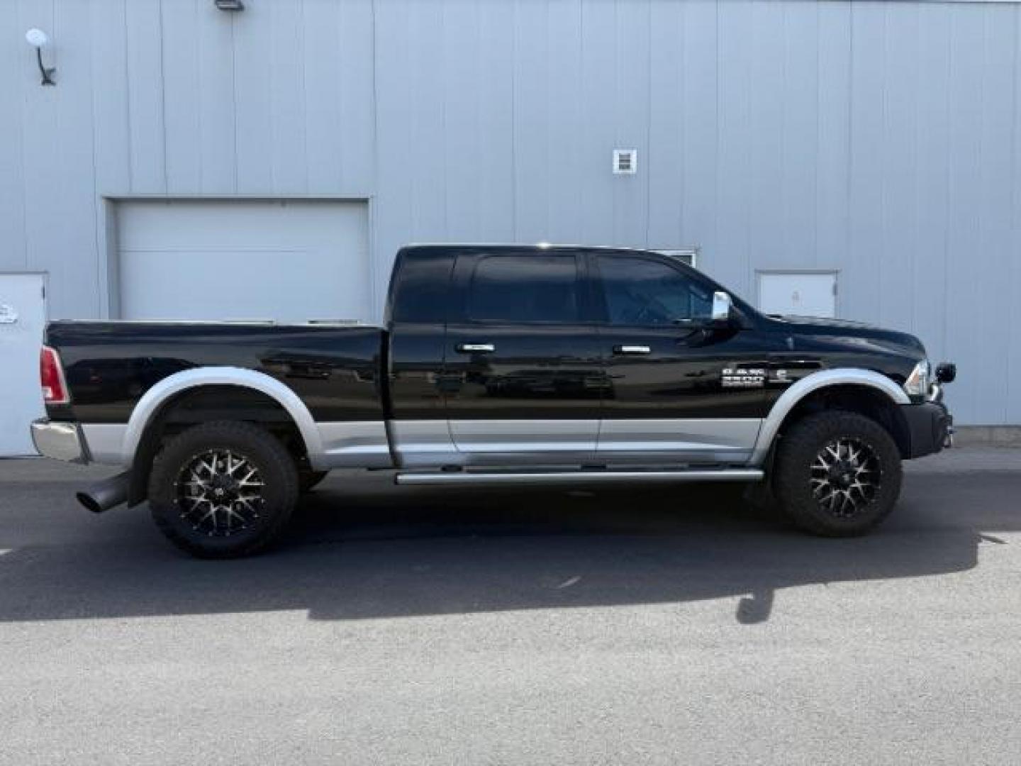 2013 Black Clearcoat /Black Ram 2500 Laramie (3C6UR5NL8DG) with an Cummins 6.7L I-6 diesel direct injection engine, AUTOMATIC transmission, located at 1235 N Woodruff Ave., Idaho Falls, 83401, (208) 523-1053, 43.507172, -112.000488 - At Timberline Auto, finding a great deal on your next vehicle is always easy! Our experienced sales staff's goal is to help find you the right vehicle at the right price! Our knowledgeable finance department has options for almost any credit score. We offer extended service contract options to prote - Photo#3