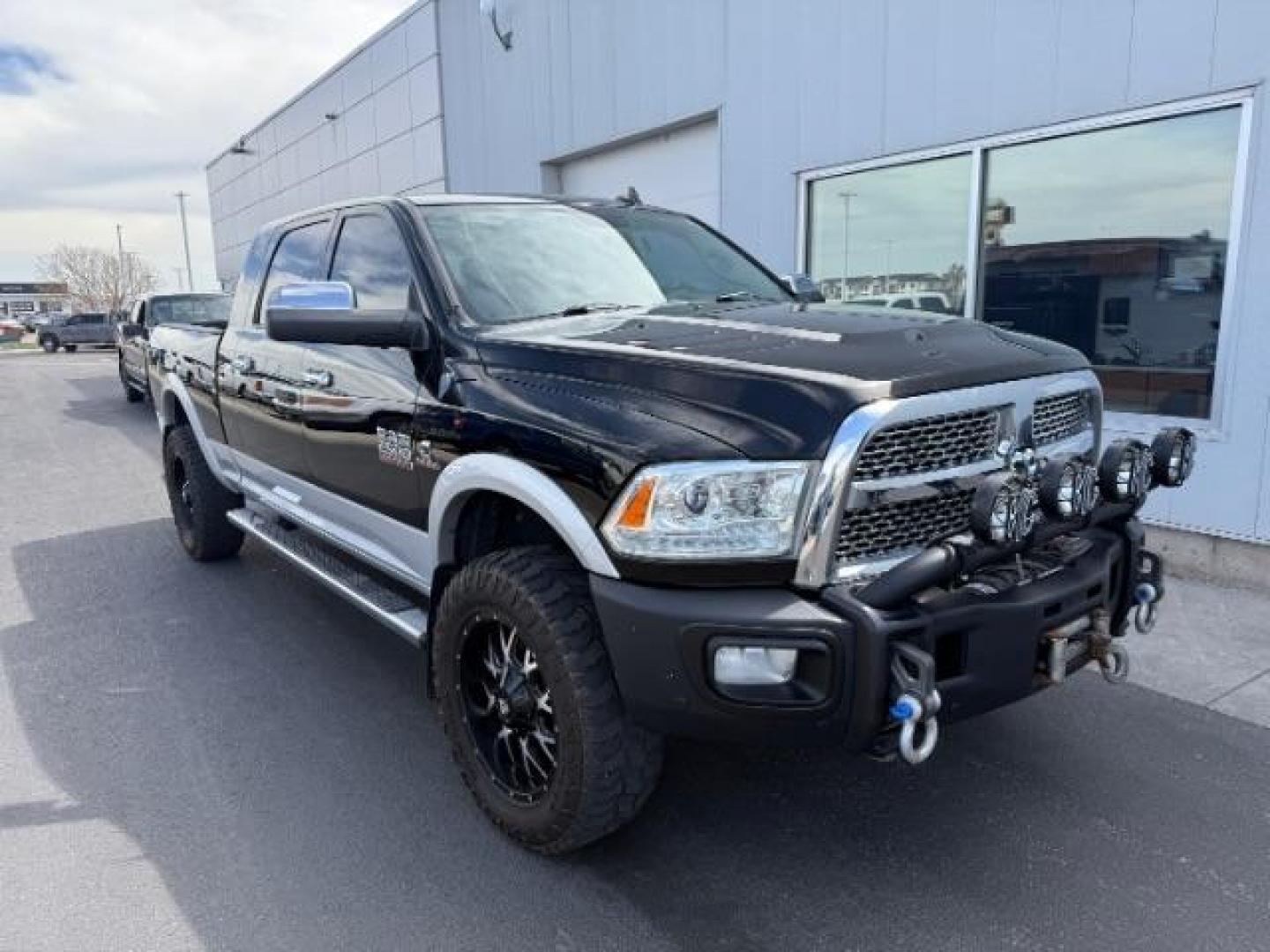 2013 Black Clearcoat /Black Ram 2500 Laramie (3C6UR5NL8DG) with an Cummins 6.7L I-6 diesel direct injection engine, AUTOMATIC transmission, located at 1235 N Woodruff Ave., Idaho Falls, 83401, (208) 523-1053, 43.507172, -112.000488 - At Timberline Auto, finding a great deal on your next vehicle is always easy! Our experienced sales staff's goal is to help find you the right vehicle at the right price! Our knowledgeable finance department has options for almost any credit score. We offer extended service contract options to prote - Photo#2