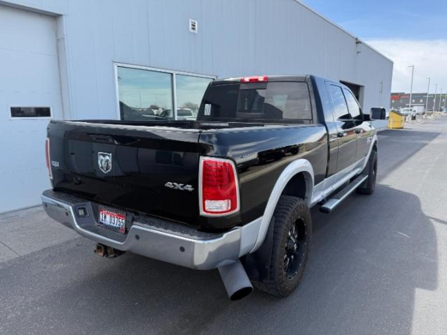 2013 Black Clearcoat /Black Ram 2500 Laramie (3C6UR5NL8DG) with an Cummins 6.7L I-6 diesel direct injection engine, AUTOMATIC transmission, located at 1235 N Woodruff Ave., Idaho Falls, 83401, (208) 523-1053, 43.507172, -112.000488 - At Timberline Auto, finding a great deal on your next vehicle is always easy! Our experienced sales staff's goal is to help find you the right vehicle at the right price! Our knowledgeable finance department has options for almost any credit score. We offer extended service contract options to prote - Photo#4