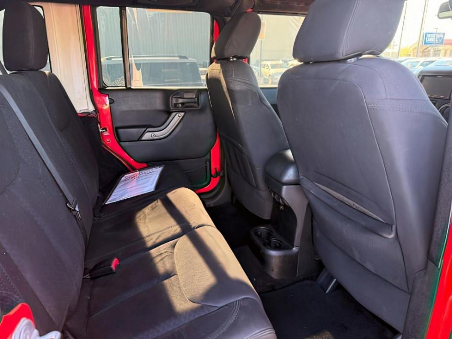 2013 ORANGE /Black Jeep Wrangler Unlimited (1C4BJWDG7DL) with an 36L V-6 DOHC engine, Automatic transmission, located at 1175 N Woodruff Ave, Idaho Falls, ID, 83401, 43.506901, -111.999657 - At Timberline Auto, finding a great deal on your next vehicle is always easy! Our experienced sales staff's goal is to help find you the right vehicle at the right price! Our knowledgeable finance department has options for almost any credit score. We offer extended service contract options to prote - Photo#11