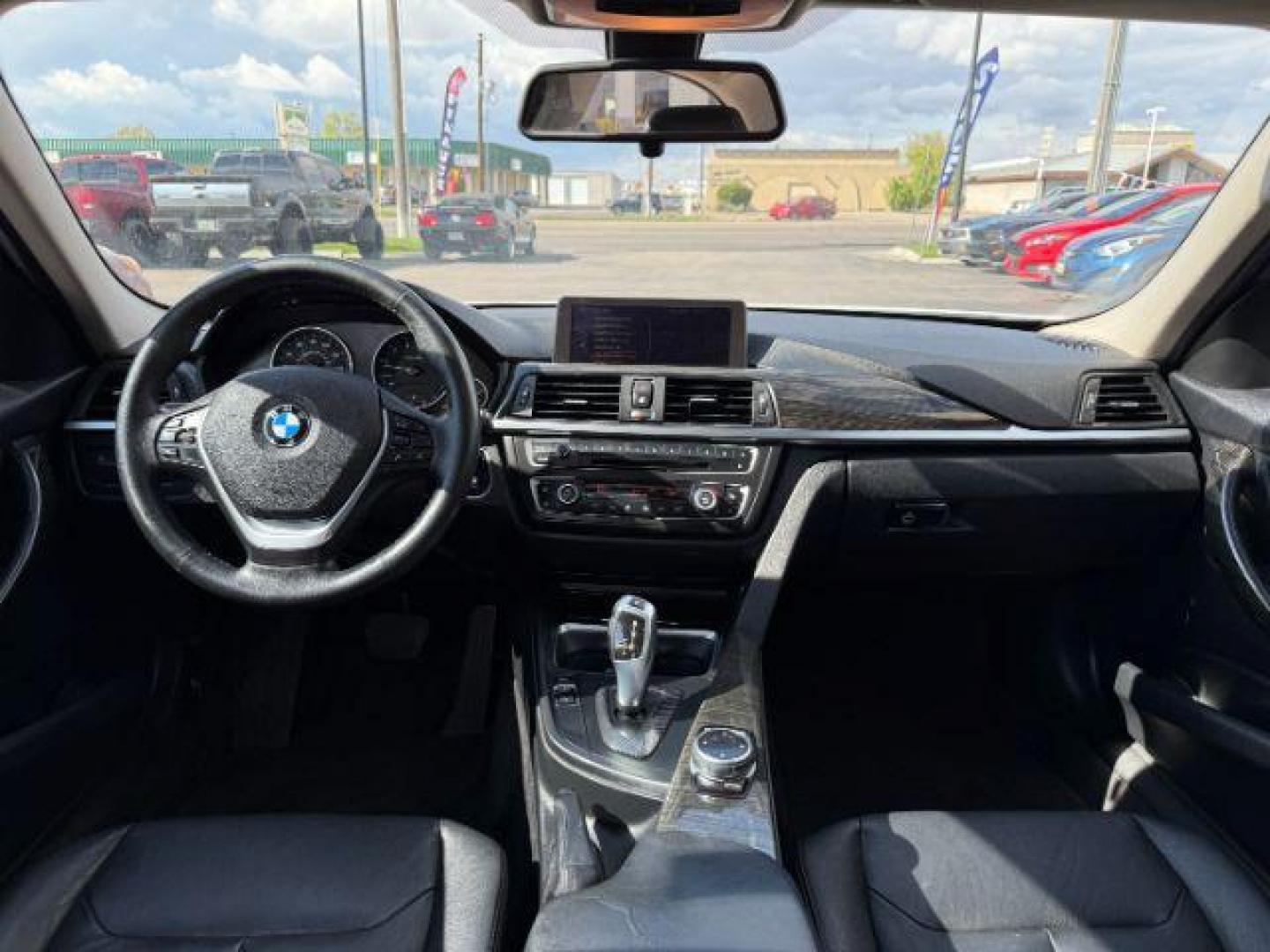 2014 Alpine White /Black BMW 320i xDrive (WBA3C3C51EF) with an 2L I-4 gasoline direct injection engine, AUTOMATIC transmission, located at 1235 N Woodruff Ave., Idaho Falls, 83401, (208) 523-1053, 43.507172, -112.000488 - At Timberline Auto, finding a great deal on your next vehicle is always easy! Our experienced sales staff's goal is to help find you the right vehicle at the right price! Our knowledgeable finance department has options for almost any credit score. We offer extended service contract options to prote - Photo#16