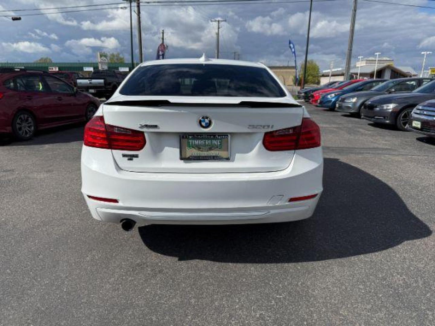 2014 Alpine White /Black BMW 320i xDrive (WBA3C3C51EF) with an 2L I-4 gasoline direct injection engine, AUTOMATIC transmission, located at 1235 N Woodruff Ave., Idaho Falls, 83401, (208) 523-1053, 43.507172, -112.000488 - At Timberline Auto, finding a great deal on your next vehicle is always easy! Our experienced sales staff's goal is to help find you the right vehicle at the right price! Our knowledgeable finance department has options for almost any credit score. We offer extended service contract options to prote - Photo#3