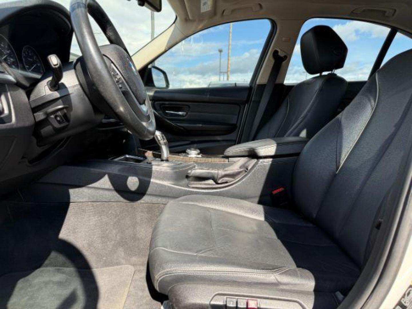 2014 Alpine White /Black BMW 320i xDrive (WBA3C3C51EF) with an 2L I-4 gasoline direct injection engine, AUTOMATIC transmission, located at 1235 N Woodruff Ave., Idaho Falls, 83401, (208) 523-1053, 43.507172, -112.000488 - At Timberline Auto, finding a great deal on your next vehicle is always easy! Our experienced sales staff's goal is to help find you the right vehicle at the right price! Our knowledgeable finance department has options for almost any credit score. We offer extended service contract options to prote - Photo#8