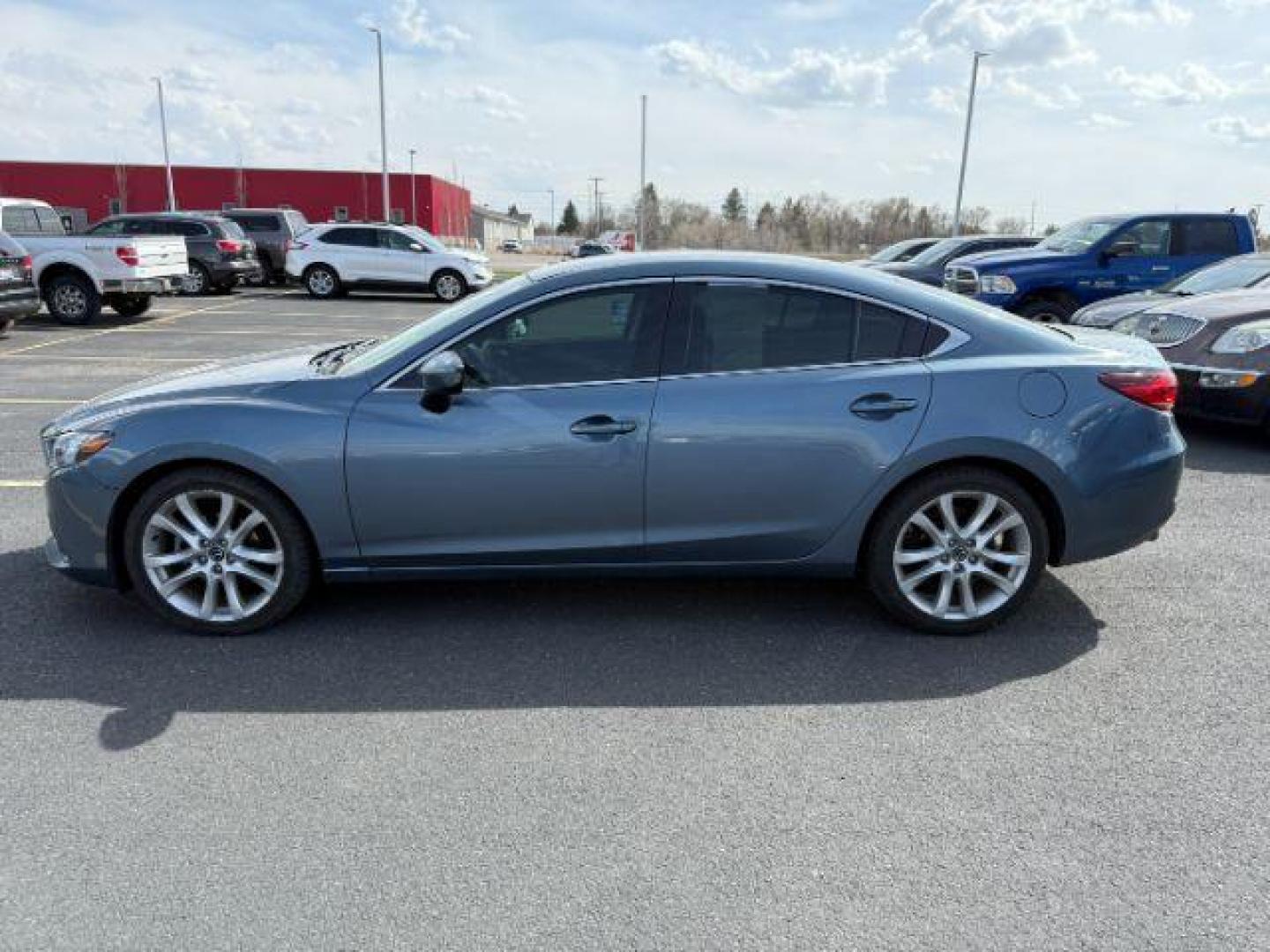 2014 Blue Reflex Mica /Black Mazda Mazda6 i Touring (JM1GJ1V67E1) with an SKYACTIV-G 2.5L I-4 gasoline direct injection engine, AUTOMATIC transmission, located at 1235 N Woodruff Ave., Idaho Falls, 83401, (208) 523-1053, 43.507172, -112.000488 - At Timberline Auto, finding a great deal on your next vehicle is always easy! Our experienced sales staff's goal is to help find you the right vehicle at the right price! Our knowledgeable finance department has options for almost any credit score. We offer extended service contract options to prote - Photo#0
