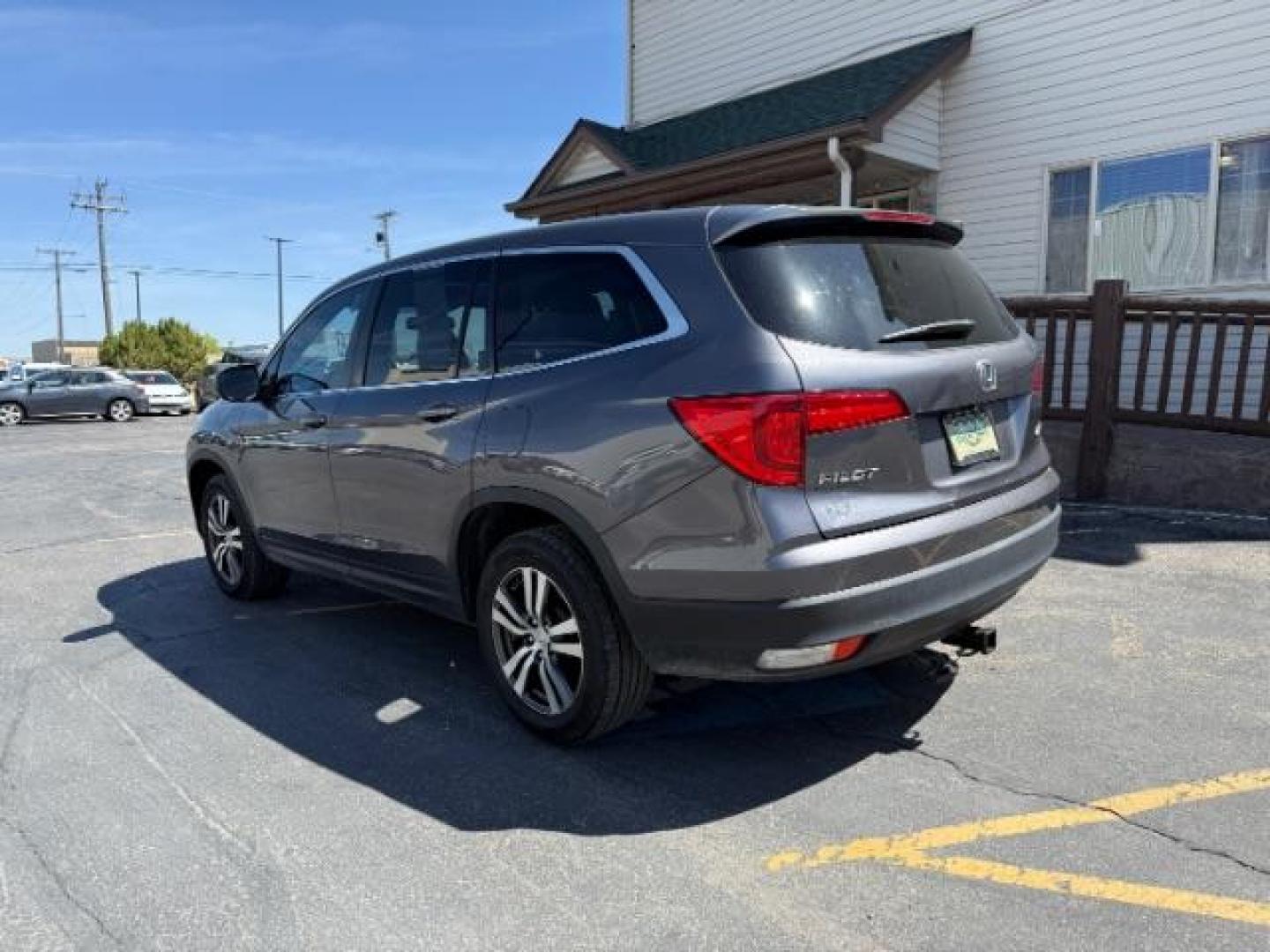 2018 GREY /Black Honda Pilot EX-L (5FNYF6H55JB) with an 3.5L V-6 gasoline direct injection engine, AUTOMATIC transmission, located at 1235 N Woodruff Ave., Idaho Falls, 83401, (208) 523-1053, 43.507172, -112.000488 - At Timberline Auto, finding a great deal on your next vehicle is always easy! Our experienced sales staff's goal is to help find you the right vehicle at the right price! Our knowledgeable finance department has options for almost any credit score. We offer extended service contract options to prote - Photo#2