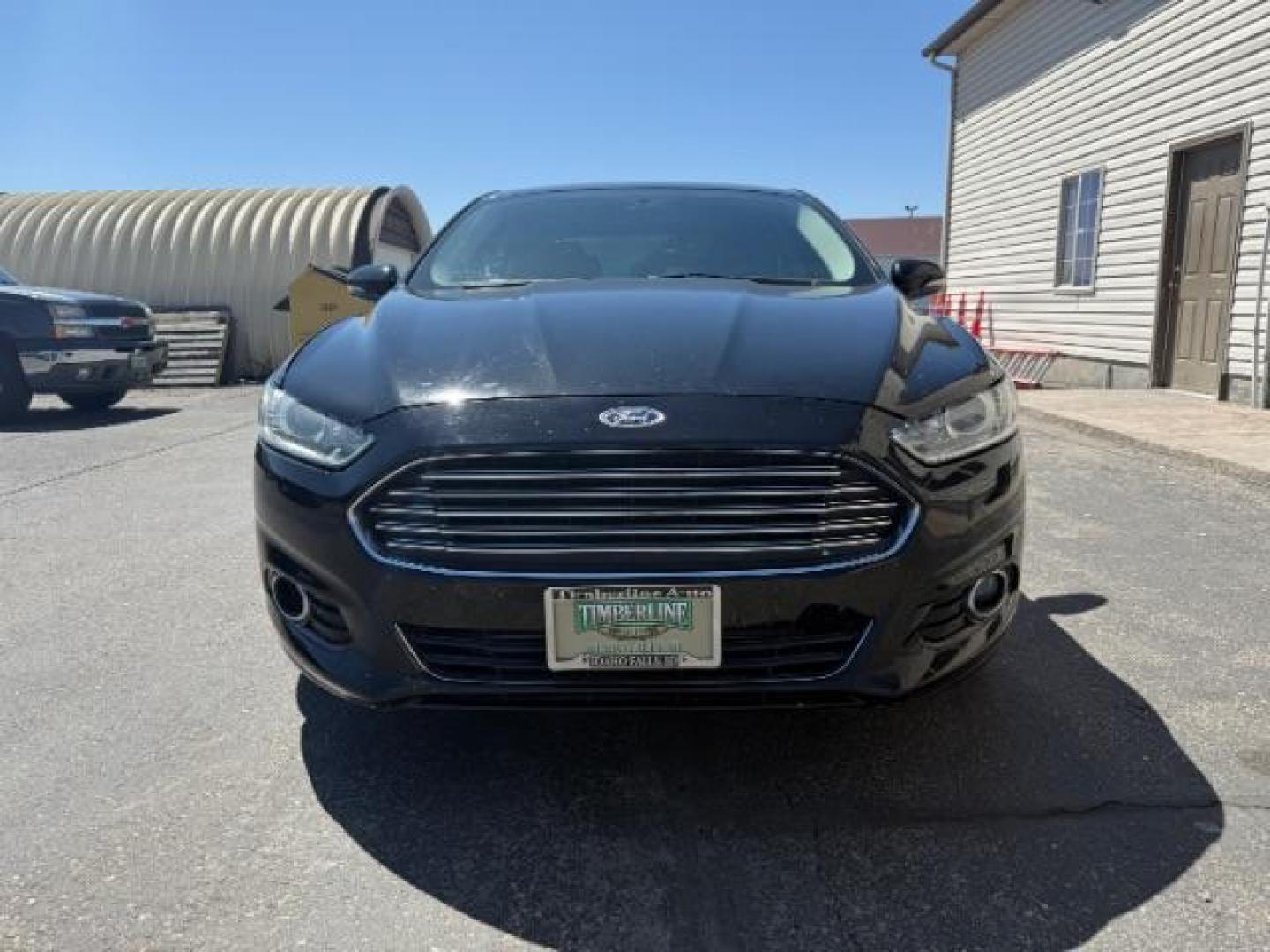2016 Shadow Black /Charcoal Black Ford Fusion Titanium (3FA6P0K9XGR) with an EcoBoost 2L I-4 gasoline direct injection engine, AUTOMATIC transmission, located at 1235 N Woodruff Ave., Idaho Falls, 83401, (208) 523-1053, 43.507172, -112.000488 - Photo#1