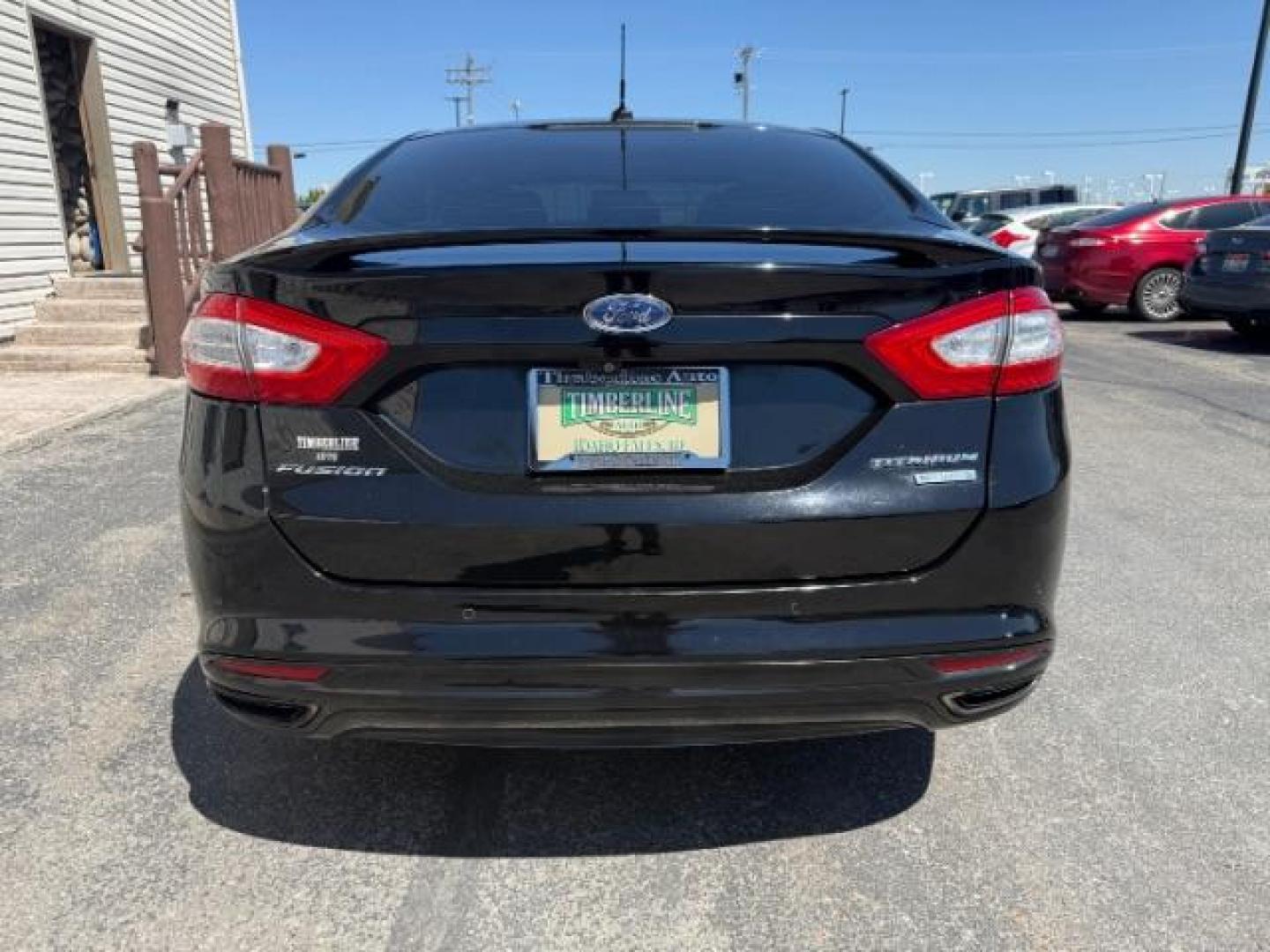 2016 Shadow Black /Charcoal Black Ford Fusion Titanium (3FA6P0K9XGR) with an EcoBoost 2L I-4 gasoline direct injection engine, AUTOMATIC transmission, located at 1235 N Woodruff Ave., Idaho Falls, 83401, (208) 523-1053, 43.507172, -112.000488 - Photo#5