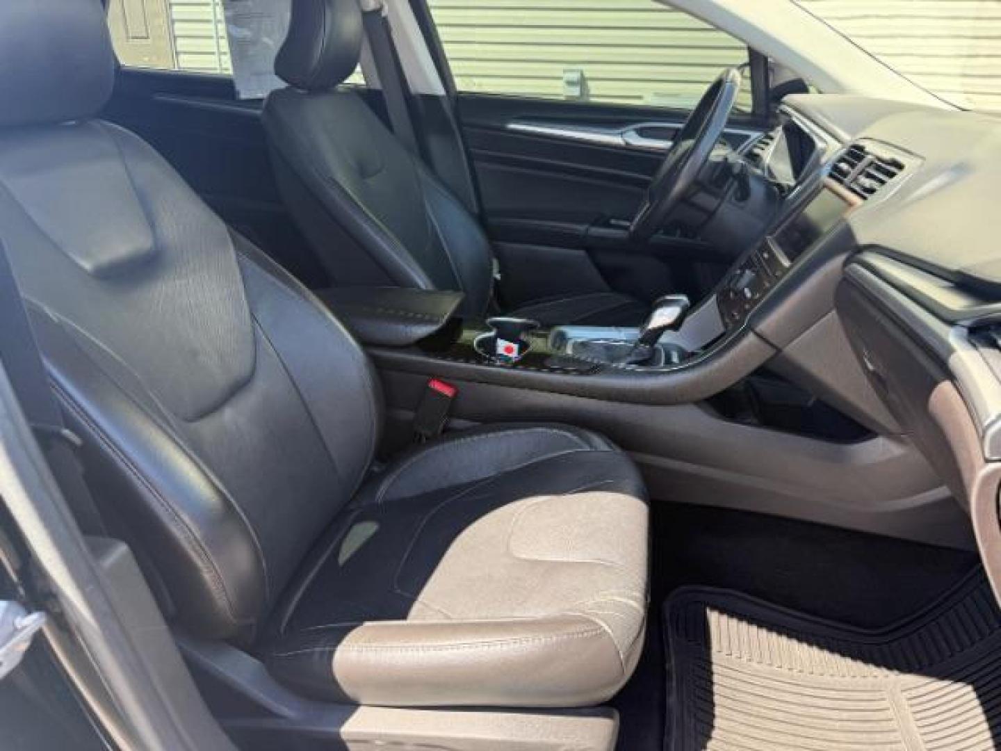 2016 Shadow Black /Charcoal Black Ford Fusion Titanium (3FA6P0K9XGR) with an EcoBoost 2L I-4 gasoline direct injection engine, AUTOMATIC transmission, located at 1235 N Woodruff Ave., Idaho Falls, 83401, (208) 523-1053, 43.507172, -112.000488 - Photo#9