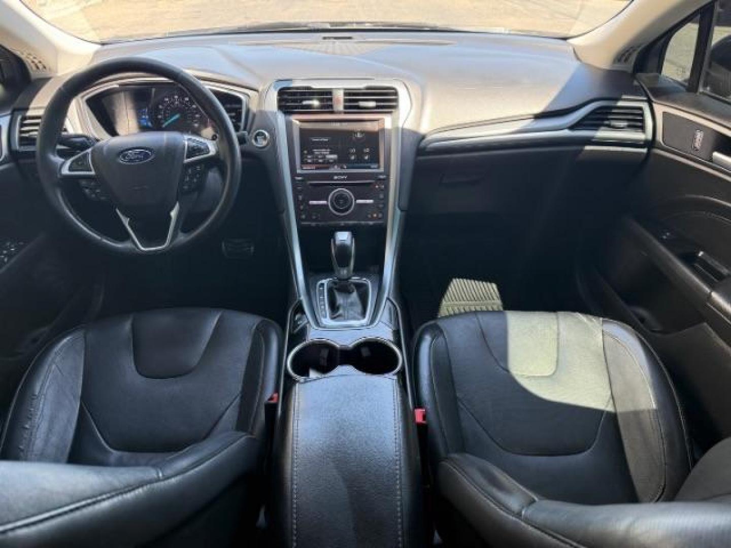 2016 Shadow Black /Charcoal Black Ford Fusion Titanium (3FA6P0K9XGR) with an EcoBoost 2L I-4 gasoline direct injection engine, AUTOMATIC transmission, located at 1235 N Woodruff Ave., Idaho Falls, 83401, (208) 523-1053, 43.507172, -112.000488 - Photo#11