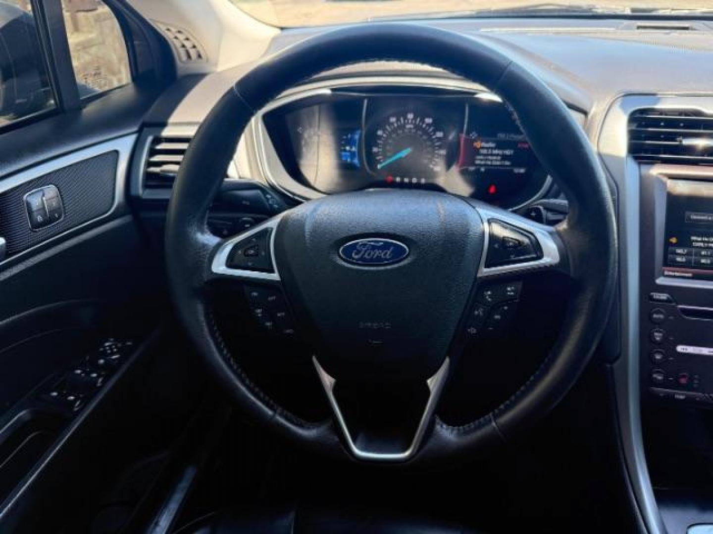 2016 Shadow Black /Charcoal Black Ford Fusion Titanium (3FA6P0K9XGR) with an EcoBoost 2L I-4 gasoline direct injection engine, AUTOMATIC transmission, located at 1235 N Woodruff Ave., Idaho Falls, 83401, (208) 523-1053, 43.507172, -112.000488 - Photo#14