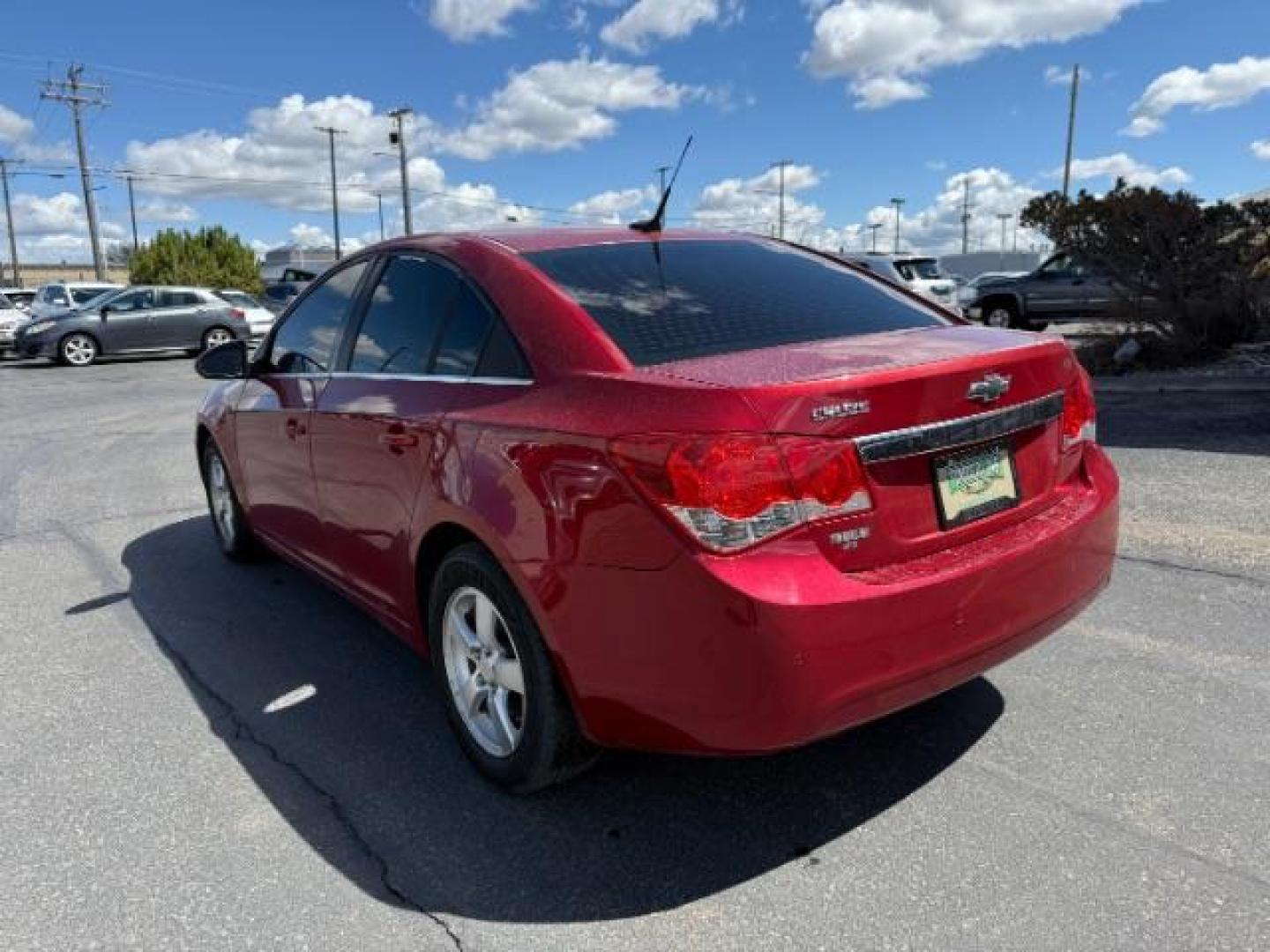 2011 Crystal Red Metallic Tintcoat /Jet Black Chevrolet Cruze 1LT (1G1PF5S9XB7) with an Ecotec 1.4L I-4 DOHC engine, AUTOMATIC transmission, located at 1235 N Woodruff Ave., Idaho Falls, 83401, (208) 523-1053, 43.507172, -112.000488 - Photo#2