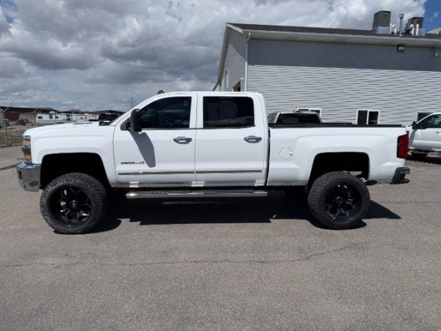 2015 Summit White /Cocoa/Dune Chevrolet Silverado 2500HD LTZ (1GC1KWE82FF) with an 6.6 engine, AUTOMATIC transmission, located at 1235 N Woodruff Ave., Idaho Falls, 83401, (208) 523-1053, 43.507172, -112.000488 - At Timberline Auto, finding a great deal on your next vehicle is always easy! Our experienced sales staff's goal is to help find you the right vehicle at the right price! Our knowledgeable finance department has options for almost any credit score. We offer extended service contract options to prote - Photo#1