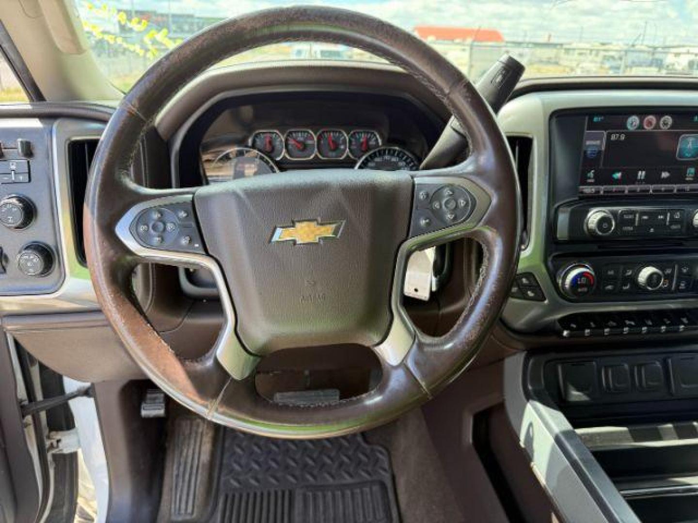 2015 Summit White /Cocoa/Dune Chevrolet Silverado 2500HD LTZ (1GC1KWE82FF) with an 6.6 engine, AUTOMATIC transmission, located at 1235 N Woodruff Ave., Idaho Falls, 83401, (208) 523-1053, 43.507172, -112.000488 - At Timberline Auto, finding a great deal on your next vehicle is always easy! Our experienced sales staff's goal is to help find you the right vehicle at the right price! Our knowledgeable finance department has options for almost any credit score. We offer extended service contract options to prote - Photo#9
