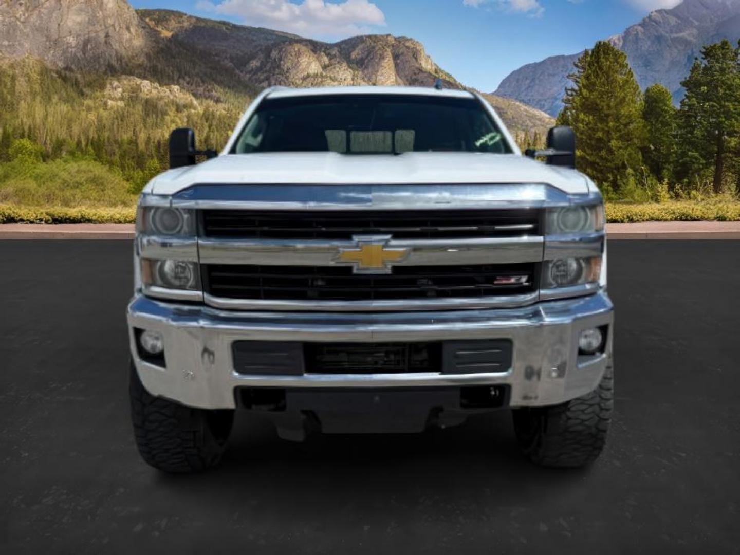 2015 Summit White /Cocoa/Dune Chevrolet Silverado 2500HD LTZ (1GC1KWE82FF) with an 6.6 engine, AUTOMATIC transmission, located at 1235 N Woodruff Ave., Idaho Falls, 83401, (208) 523-1053, 43.507172, -112.000488 - At Timberline Auto, finding a great deal on your next vehicle is always easy! Our experienced sales staff's goal is to help find you the right vehicle at the right price! Our knowledgeable finance department has options for almost any credit score. We offer extended service contract options to prote - Photo#6