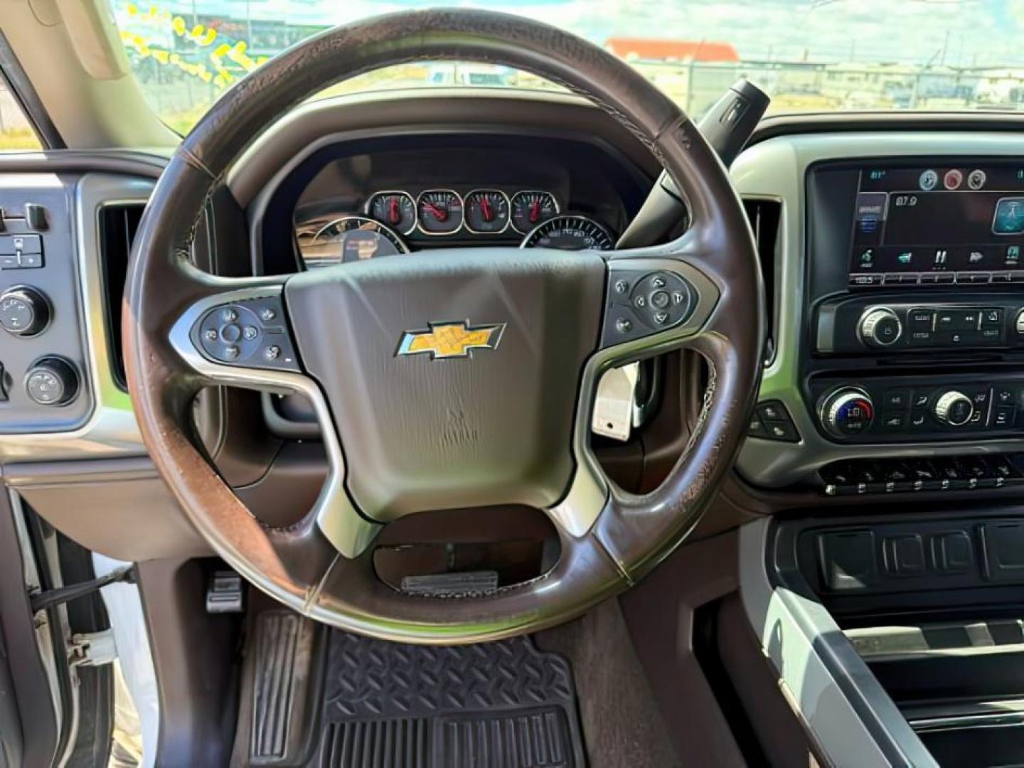 2015 Summit White /Cocoa/Dune Chevrolet Silverado 2500HD LTZ (1GC1KWE82FF) with an 6.6 engine, AUTOMATIC transmission, located at 1235 N Woodruff Ave., Idaho Falls, 83401, (208) 523-1053, 43.507172, -112.000488 - At Timberline Auto, finding a great deal on your next vehicle is always easy! Our experienced sales staff's goal is to help find you the right vehicle at the right price! Our knowledgeable finance department has options for almost any credit score. We offer extended service contract options to prote - Photo#9
