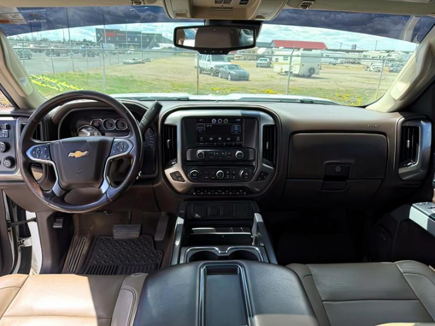 2015 Summit White /Cocoa/Dune Chevrolet Silverado 2500HD LTZ (1GC1KWE82FF) with an 6.6 engine, AUTOMATIC transmission, located at 1235 N Woodruff Ave., Idaho Falls, 83401, (208) 523-1053, 43.507172, -112.000488 - At Timberline Auto, finding a great deal on your next vehicle is always easy! Our experienced sales staff's goal is to help find you the right vehicle at the right price! Our knowledgeable finance department has options for almost any credit score. We offer extended service contract options to prote - Photo#16
