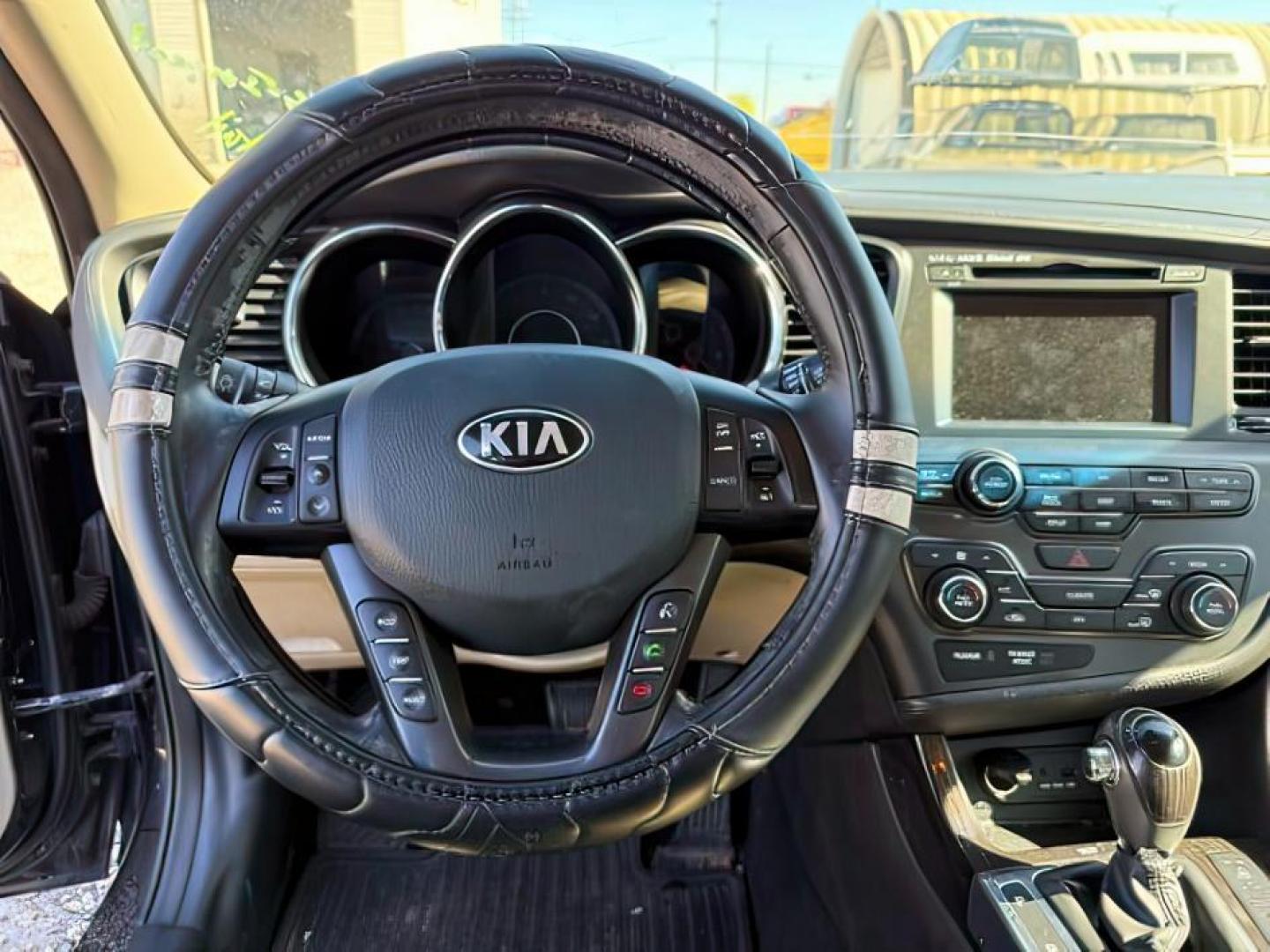 2013 BLACK /Beige KIA Optima (5XXGN4A73DG) with an 24L I-4 gasoline direct injection engine, Automatic transmission, located at 1175 N Woodruff Ave, Idaho Falls, ID, 83401, 43.506901, -111.999657 - At Timberline Auto, finding a great deal on your next vehicle is always easy! Our experienced sales staff's goal is to help find you the right vehicle at the right price! Our knowledgeable finance department has options for almost any credit score. We offer extended service contract options to prote - Photo#10