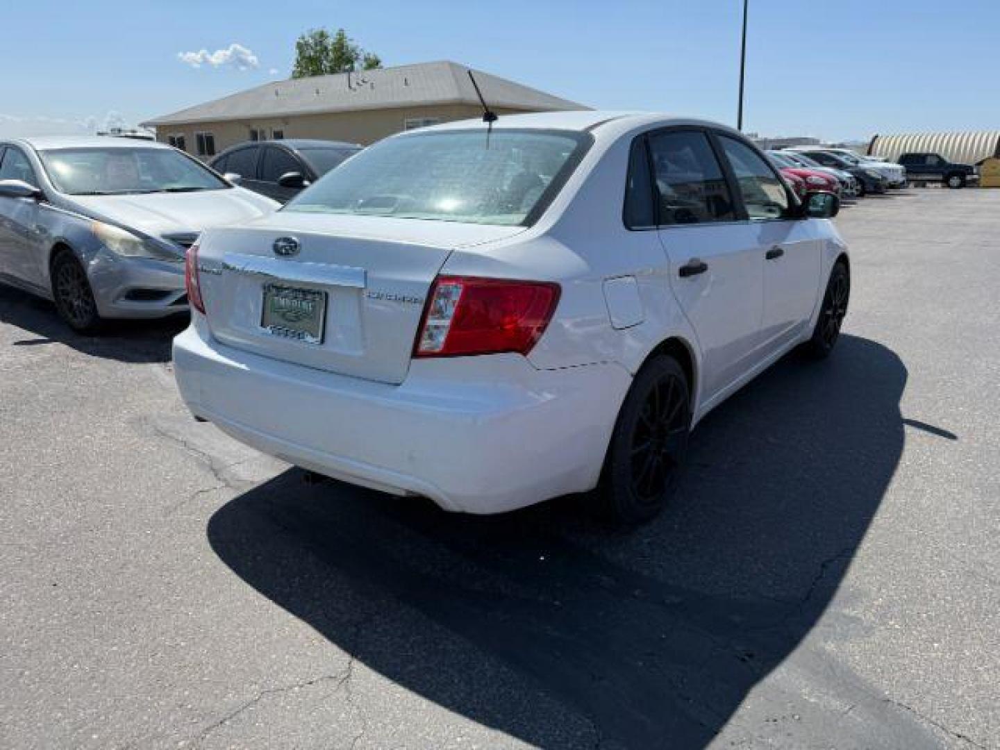 2008 Satin White Pearl /Off Black Subaru Impreza 2.5i (JF1GE61638H) with an 2.5L H-4 variable valve control engine, AUTOMATIC transmission, located at 1235 N Woodruff Ave., Idaho Falls, 83401, (208) 523-1053, 43.507172, -112.000488 - At Timberline Auto, finding a great deal on your next vehicle is always easy! Our experienced sales staff's goal is to help find you the right vehicle at the right price! Our knowledgeable finance department has options for almost any credit score. We offer extended service contract options to prote - Photo#21