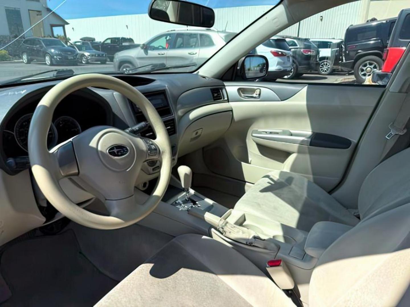 2008 Satin White Pearl /Off Black Subaru Impreza 2.5i (JF1GE61638H) with an 2.5L H-4 variable valve control engine, AUTOMATIC transmission, located at 1235 N Woodruff Ave., Idaho Falls, 83401, (208) 523-1053, 43.507172, -112.000488 - At Timberline Auto, finding a great deal on your next vehicle is always easy! Our experienced sales staff's goal is to help find you the right vehicle at the right price! Our knowledgeable finance department has options for almost any credit score. We offer extended service contract options to prote - Photo#9