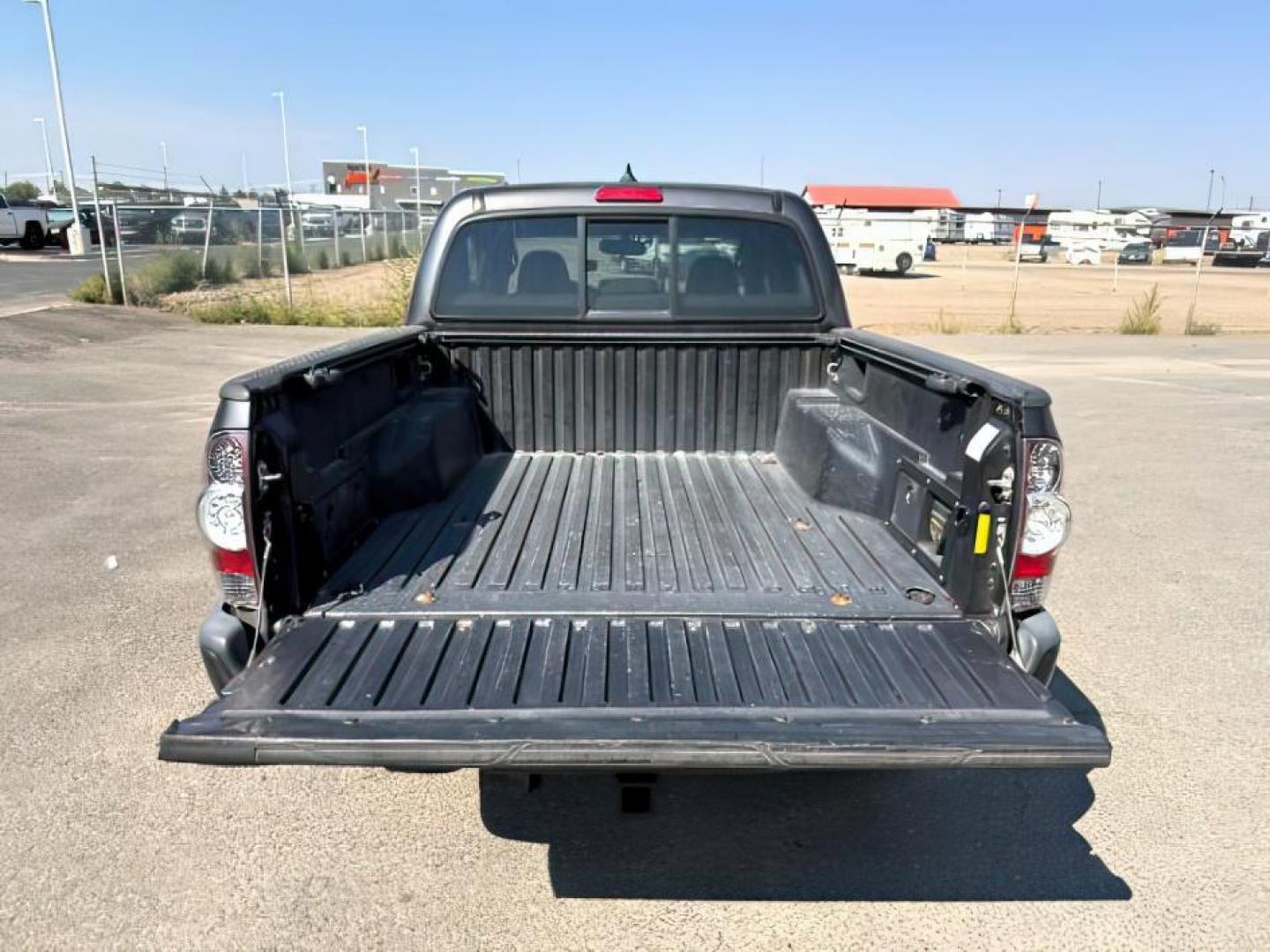 2012 Magnetic Gray Metallic /Graphite Toyota Tacoma (3TMJU4GN1CM) with an 4L V-6 DOHC engine, Automatic transmission, located at 1175 N Woodruff Ave, Idaho Falls, ID, 83401, 43.506901, -111.999657 - At Timberline Auto, finding a great deal on your next vehicle is always easy! Our experienced sales staff's goal is to help find you the right vehicle at the right price! Our knowledgeable finance department has options for almost any credit score. We offer extended service contract options to prote - Photo#5