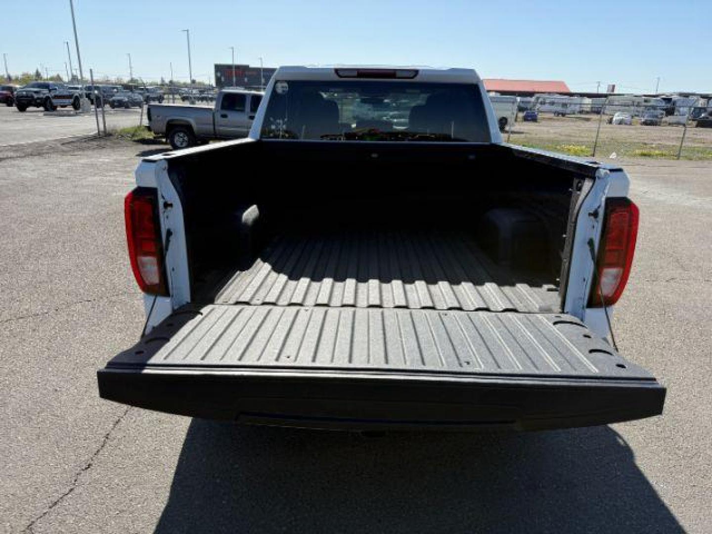 2021 Summit White /Jet Black GMC Sierra 1500 4WD Crew Cab Short Box Elevation (3GTU9CET8MG) with an Duramax 3L I-6 diesel direct injection engine, AUTOMATIC transmission, located at 1235 N Woodruff Ave., Idaho Falls, 83401, (208) 523-1053, 43.507172, -112.000488 - At Timberline Auto, finding a great deal on your next vehicle is always easy! Our experienced sales staff's goal is to help find you the right vehicle at the right price! Our knowledgeable finance department has options for almost any credit score. We offer extended service contract options to prote - Photo#5