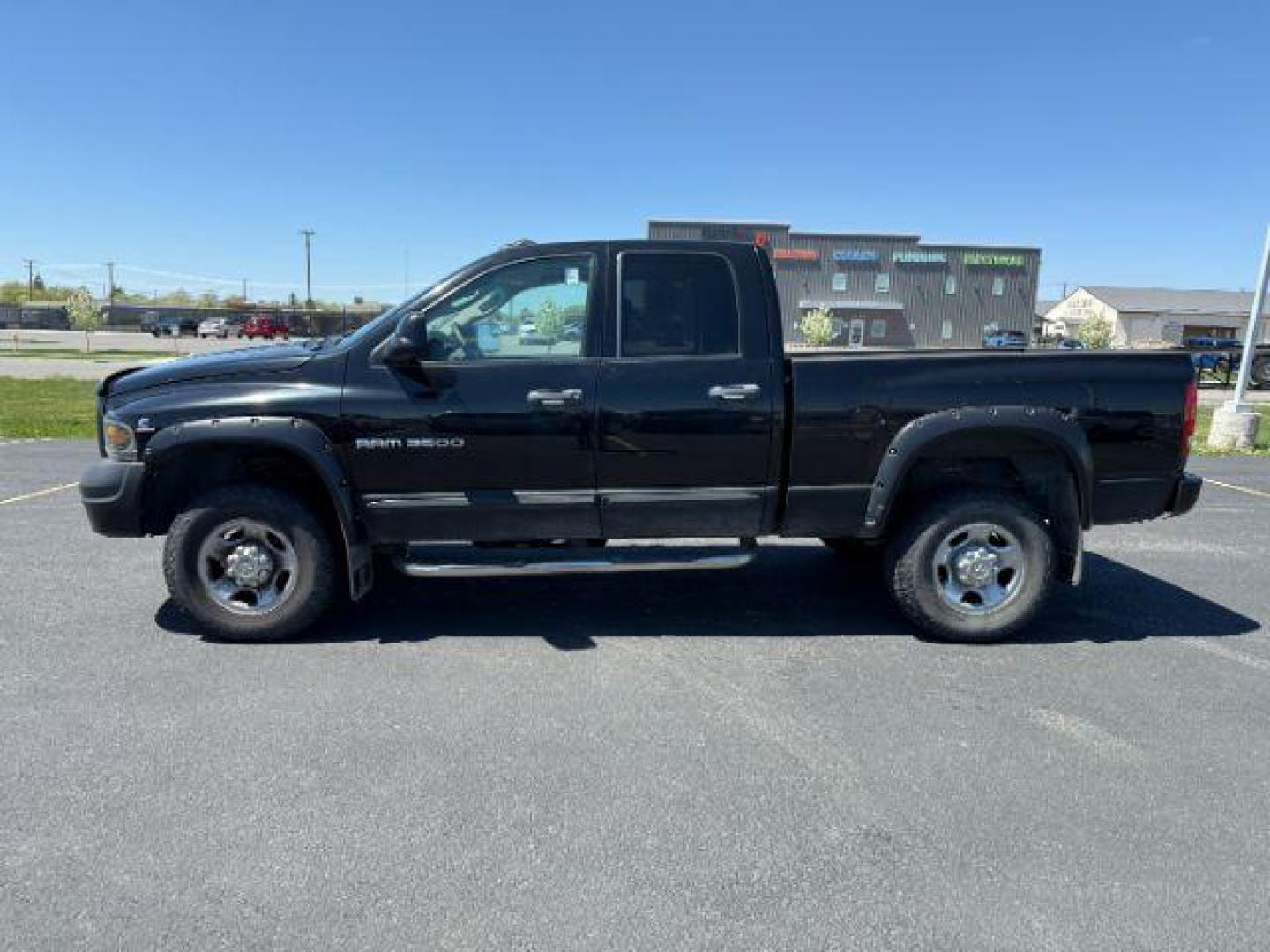 2005 BLACK /LEATHER Dodge Ram 3500 Laramie Quad Cab Short Bed 4WD (3D7LS38CX5G) with an 5.9 engine, AUTOMATIC transmission, located at 1235 N Woodruff Ave., Idaho Falls, 83401, (208) 523-1053, 43.507172, -112.000488 - At Timberline Auto, finding a great deal on your next vehicle is always easy! Our experienced sales staff's goal is to help find you the right vehicle at the right price! Our knowledgeable finance department has options for almost any credit score. We offer extended service contract options to prote - Photo#0