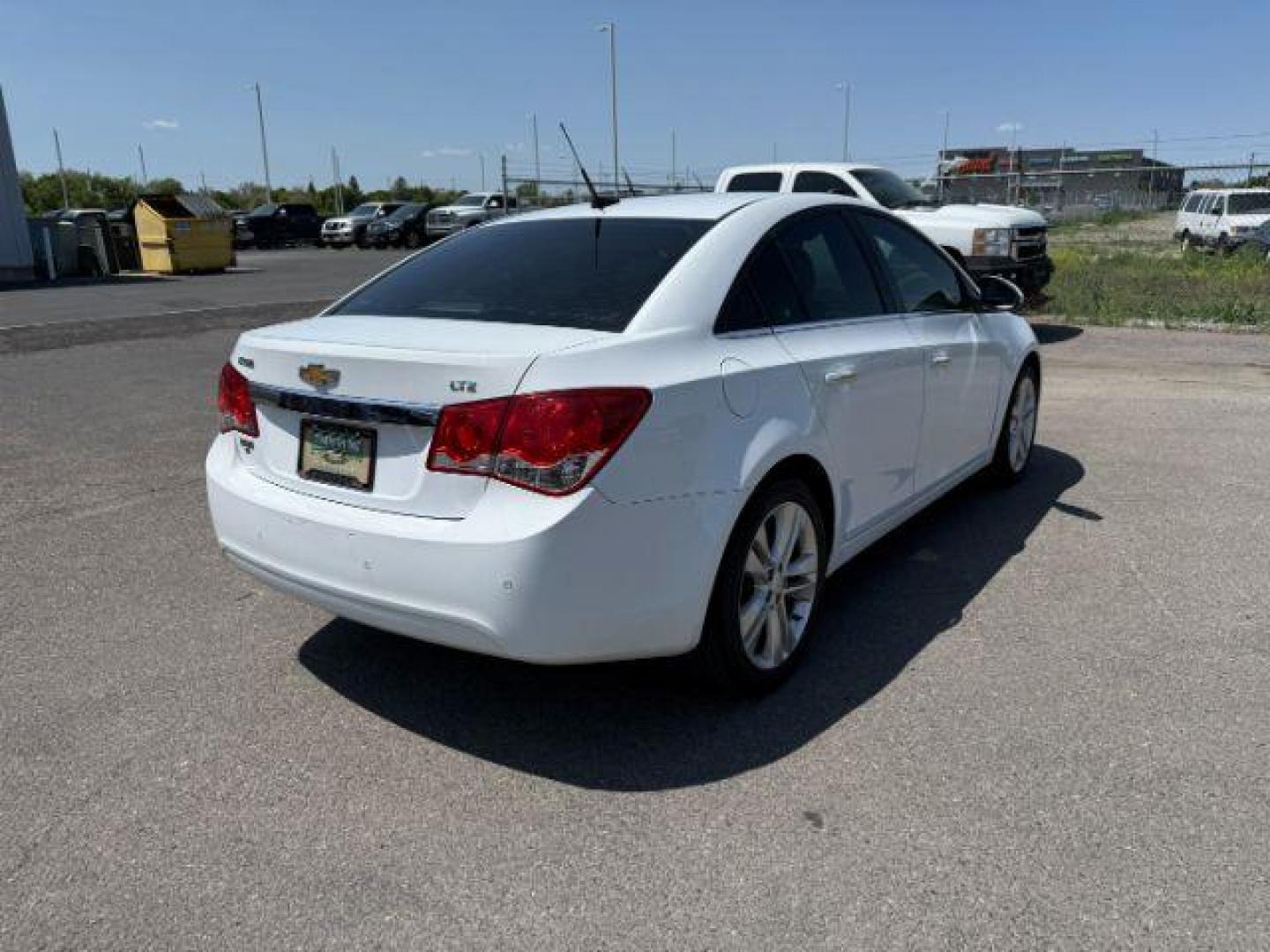 2011 Summit White /Jet Black Chevrolet Cruze LTZ (1G1PH5S96B7) with an Ecotec 1.4L I-4 DOHC engine, AUTOMATIC transmission, located at 1235 N Woodruff Ave., Idaho Falls, 83401, (208) 523-1053, 43.507172, -112.000488 - At Timberline Auto, finding a great deal on your next vehicle is always easy! Our experienced sales staff's goal is to help find you the right vehicle at the right price! Our knowledgeable finance department has options for almost any credit score. We offer extended service contract options to prote - Photo#4