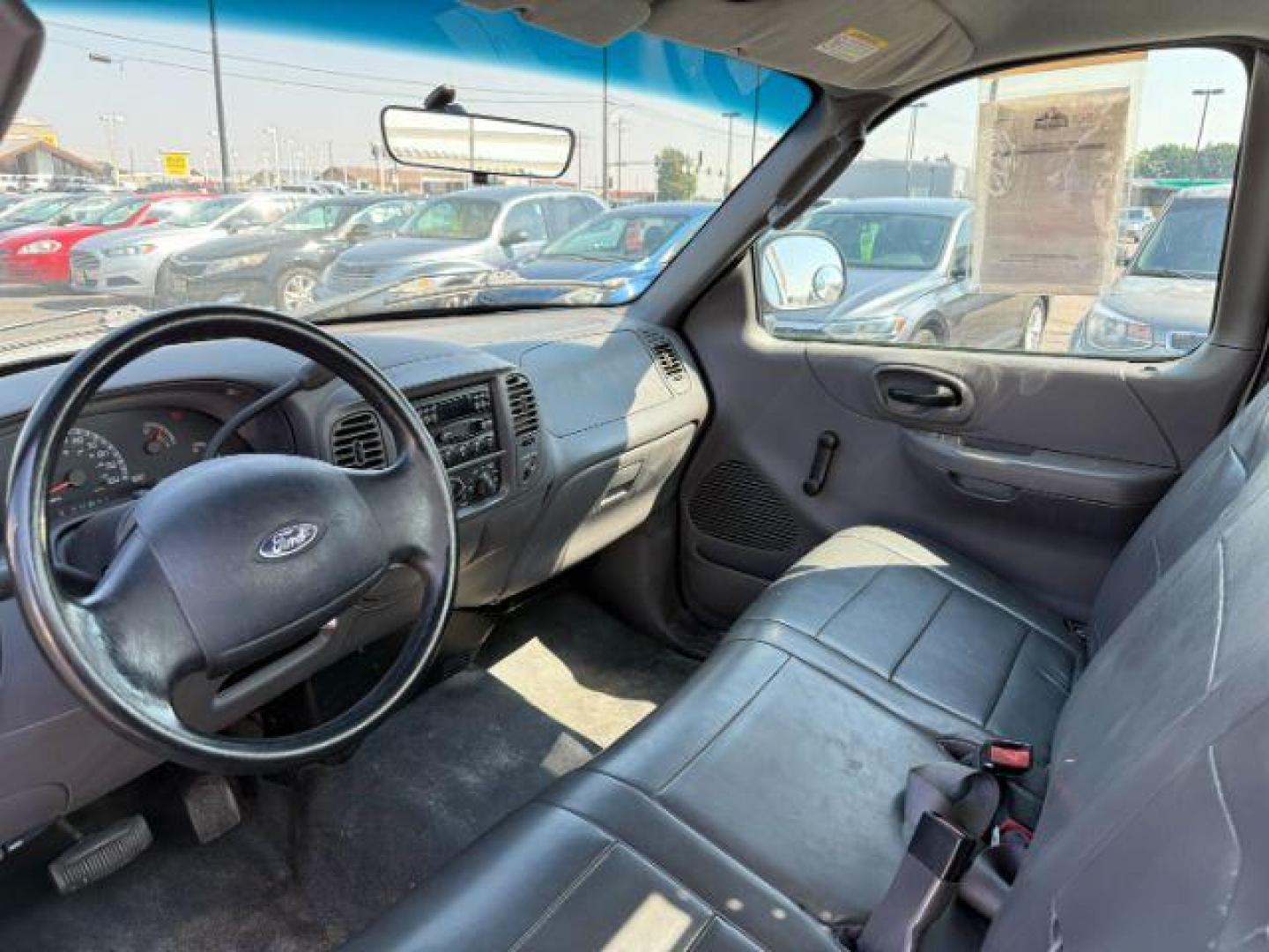 2004 Oxford White /Medium Graphite Ford F-150 Heritage (2FTRF17214C) with an 42L V-6 regular unleaded engine, Automatic transmission, located at 1175 N Woodruff Ave, Idaho Falls, ID, 83401, 43.506901, -111.999657 - At Timberline Auto, finding a great deal on your next vehicle is always easy! Our experienced sales staff's goal is to help find you the right vehicle at the right price! Our knowledgeable finance department has options for almost any credit score. We offer extended service contract options to prote - Photo#12