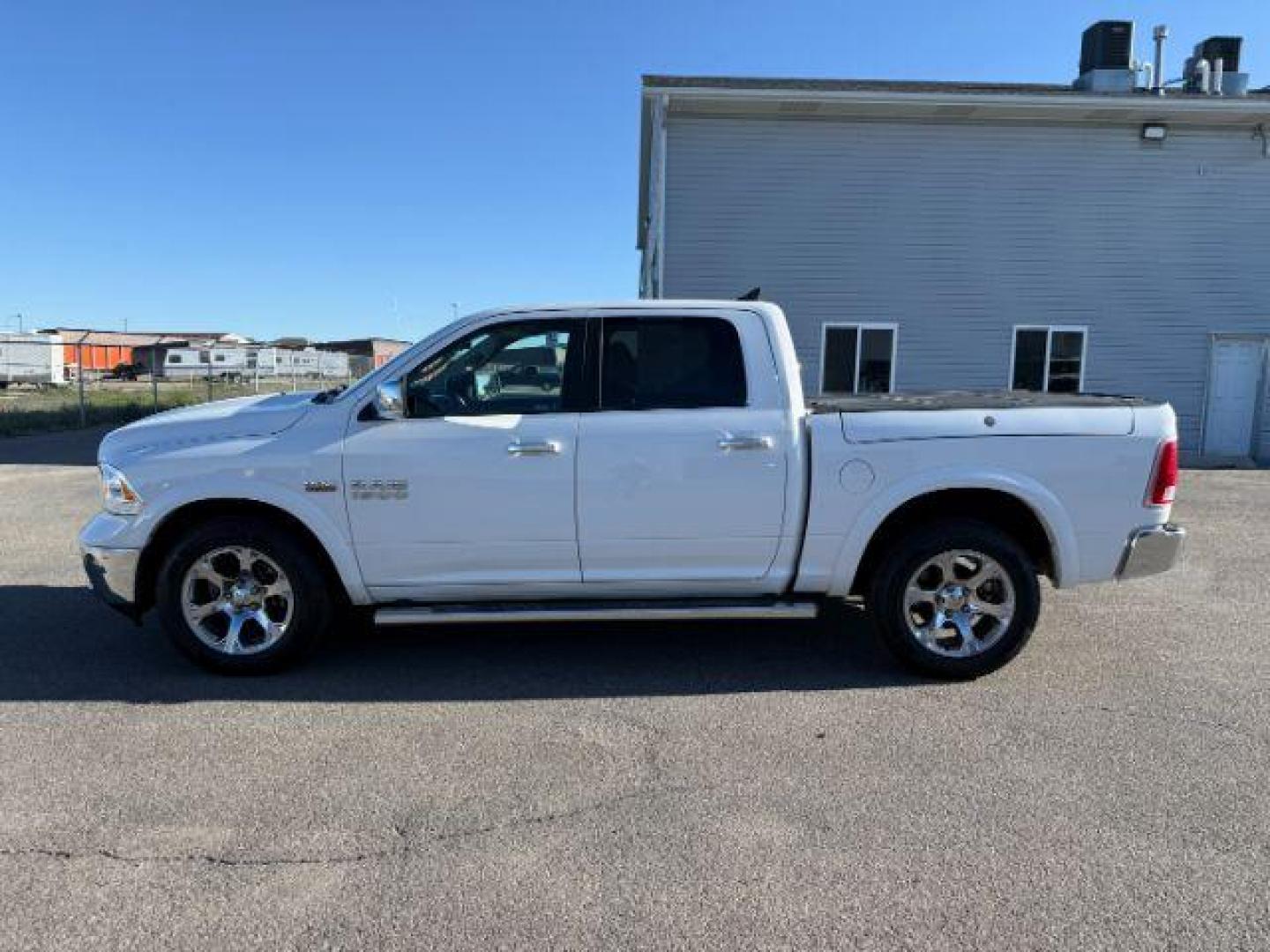 2017 Bright White Clearcoat /Black Ram 1500 Laramie Crew Cab 4x4 5'7 Box (1C6RR7NTXHS) with an HEMI 5.7L V-8 variable valve control engine, AUTOMATIC transmission, located at 1235 N Woodruff Ave., Idaho Falls, 83401, (208) 523-1053, 43.507172, -112.000488 - At Timberline Auto, finding a great deal on your next vehicle is always easy! Our experienced sales staff's goal is to help find you the right vehicle at the right price! Our knowledgeable finance department has options for almost any credit score. We offer extended service contract options to prote - Photo#1