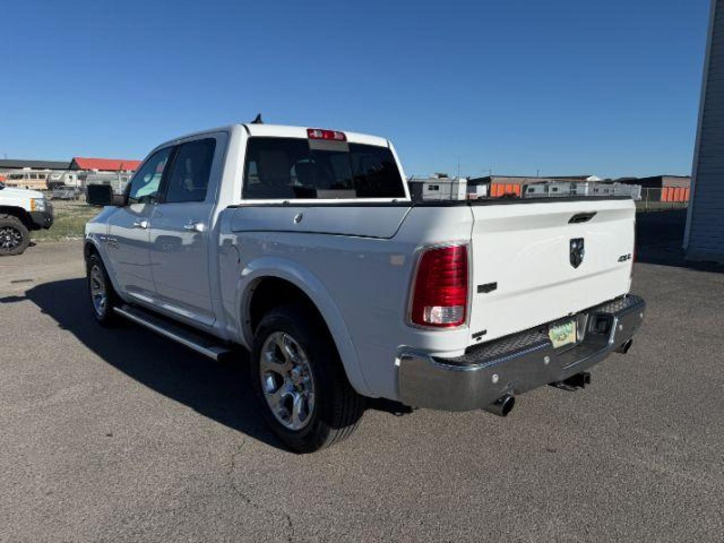 2017 Bright White Clearcoat /Black Ram 1500 Laramie Crew Cab 4x4 5'7 Box (1C6RR7NTXHS) with an HEMI 5.7L V-8 variable valve control engine, AUTOMATIC transmission, located at 1235 N Woodruff Ave., Idaho Falls, 83401, (208) 523-1053, 43.507172, -112.000488 - At Timberline Auto, finding a great deal on your next vehicle is always easy! Our experienced sales staff's goal is to help find you the right vehicle at the right price! Our knowledgeable finance department has options for almost any credit score. We offer extended service contract options to prote - Photo#2
