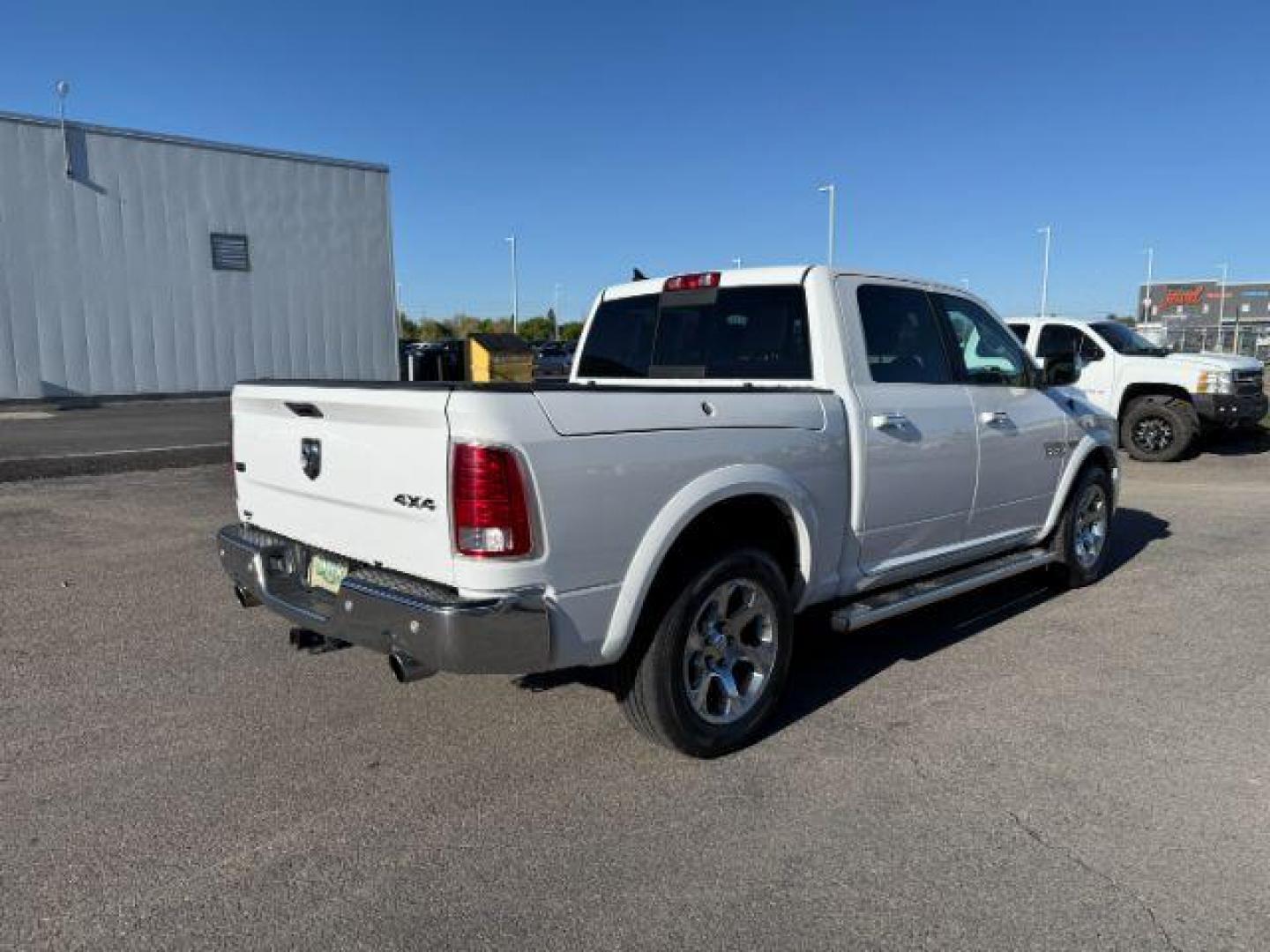 2017 Bright White Clearcoat /Black Ram 1500 Laramie Crew Cab 4x4 5'7 Box (1C6RR7NTXHS) with an HEMI 5.7L V-8 variable valve control engine, AUTOMATIC transmission, located at 1235 N Woodruff Ave., Idaho Falls, 83401, (208) 523-1053, 43.507172, -112.000488 - At Timberline Auto, finding a great deal on your next vehicle is always easy! Our experienced sales staff's goal is to help find you the right vehicle at the right price! Our knowledgeable finance department has options for almost any credit score. We offer extended service contract options to prote - Photo#4