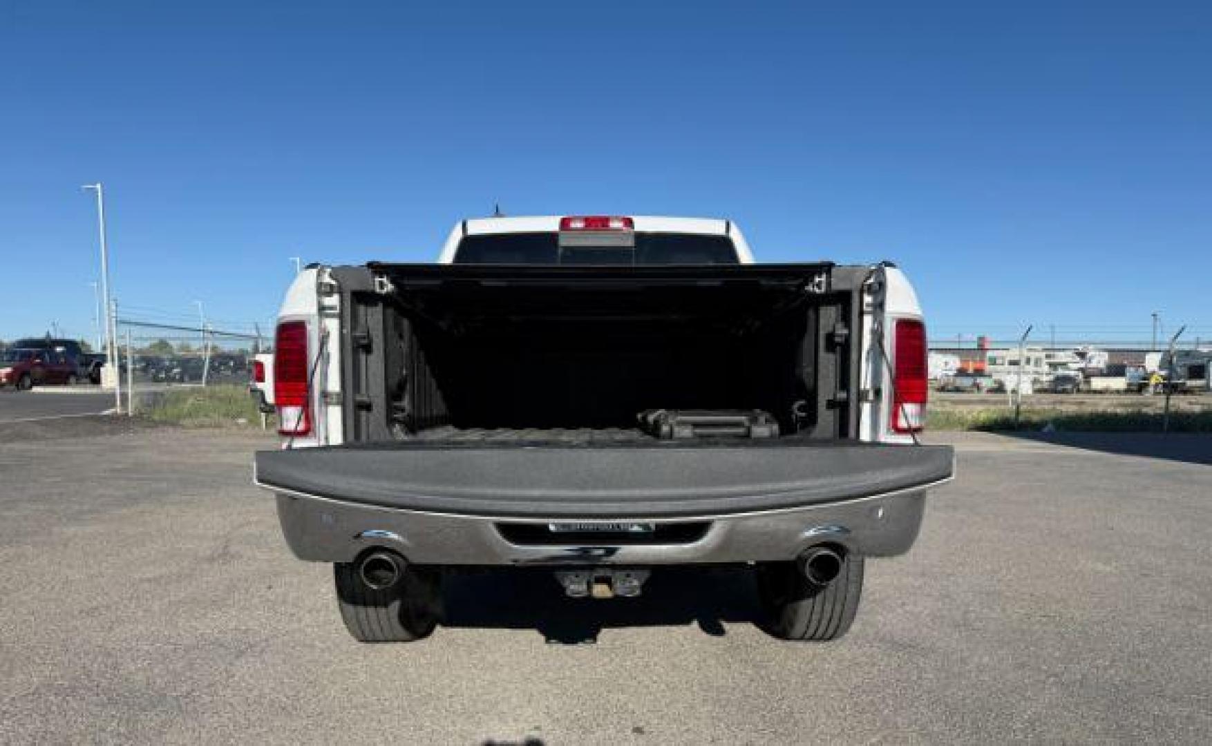 2017 Bright White Clearcoat /Black Ram 1500 Laramie Crew Cab 4x4 5'7 Box (1C6RR7NTXHS) with an HEMI 5.7L V-8 variable valve control engine, AUTOMATIC transmission, located at 1235 N Woodruff Ave., Idaho Falls, 83401, (208) 523-1053, 43.507172, -112.000488 - At Timberline Auto, finding a great deal on your next vehicle is always easy! Our experienced sales staff's goal is to help find you the right vehicle at the right price! Our knowledgeable finance department has options for almost any credit score. We offer extended service contract options to prote - Photo#6