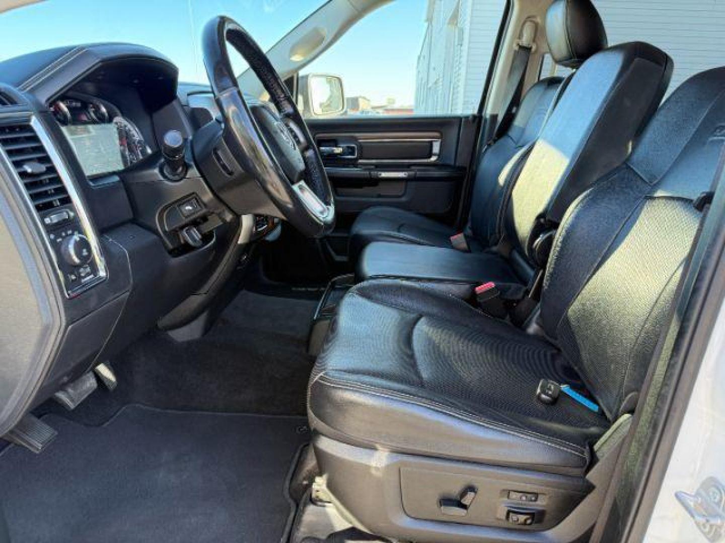 2017 Bright White Clearcoat /Black Ram 1500 Laramie Crew Cab 4x4 5'7 Box (1C6RR7NTXHS) with an HEMI 5.7L V-8 variable valve control engine, AUTOMATIC transmission, located at 1235 N Woodruff Ave., Idaho Falls, 83401, (208) 523-1053, 43.507172, -112.000488 - At Timberline Auto, finding a great deal on your next vehicle is always easy! Our experienced sales staff's goal is to help find you the right vehicle at the right price! Our knowledgeable finance department has options for almost any credit score. We offer extended service contract options to prote - Photo#12