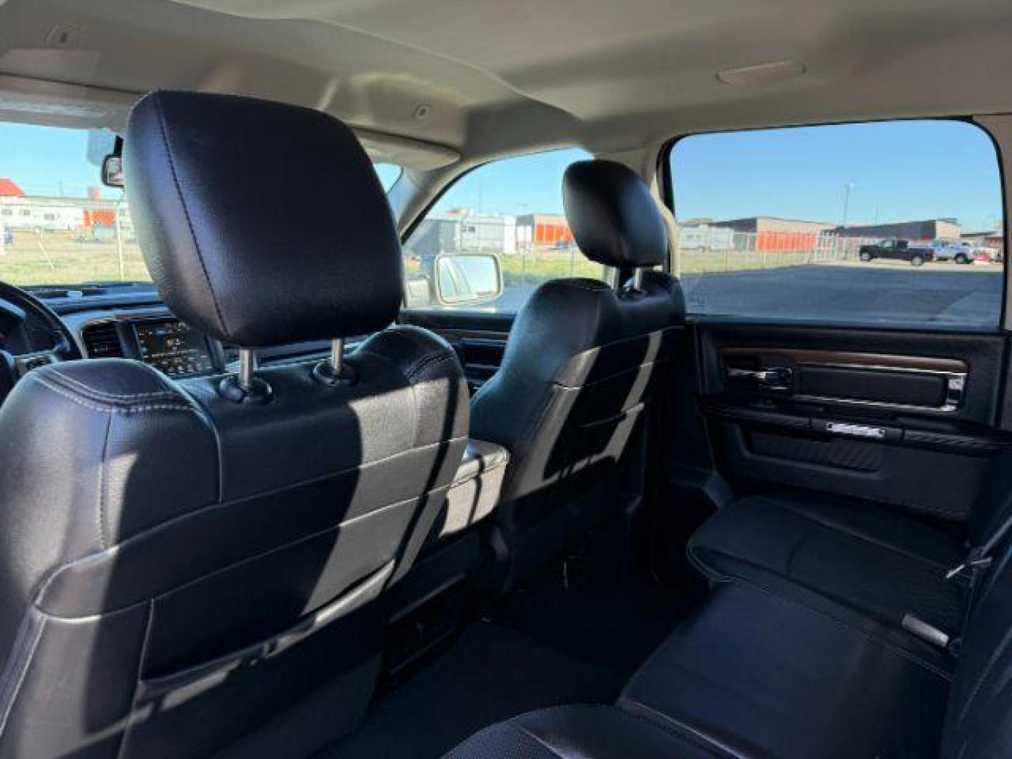 2017 Bright White Clearcoat /Black Ram 1500 Laramie Crew Cab 4x4 5'7 Box (1C6RR7NTXHS) with an HEMI 5.7L V-8 variable valve control engine, AUTOMATIC transmission, located at 1235 N Woodruff Ave., Idaho Falls, 83401, (208) 523-1053, 43.507172, -112.000488 - At Timberline Auto, finding a great deal on your next vehicle is always easy! Our experienced sales staff's goal is to help find you the right vehicle at the right price! Our knowledgeable finance department has options for almost any credit score. We offer extended service contract options to prote - Photo#21